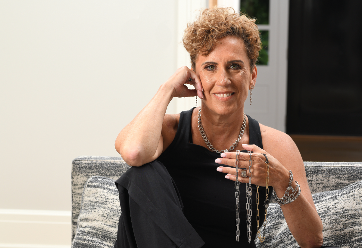 Founder Nancy Street holding our classic paper clip necklaces
