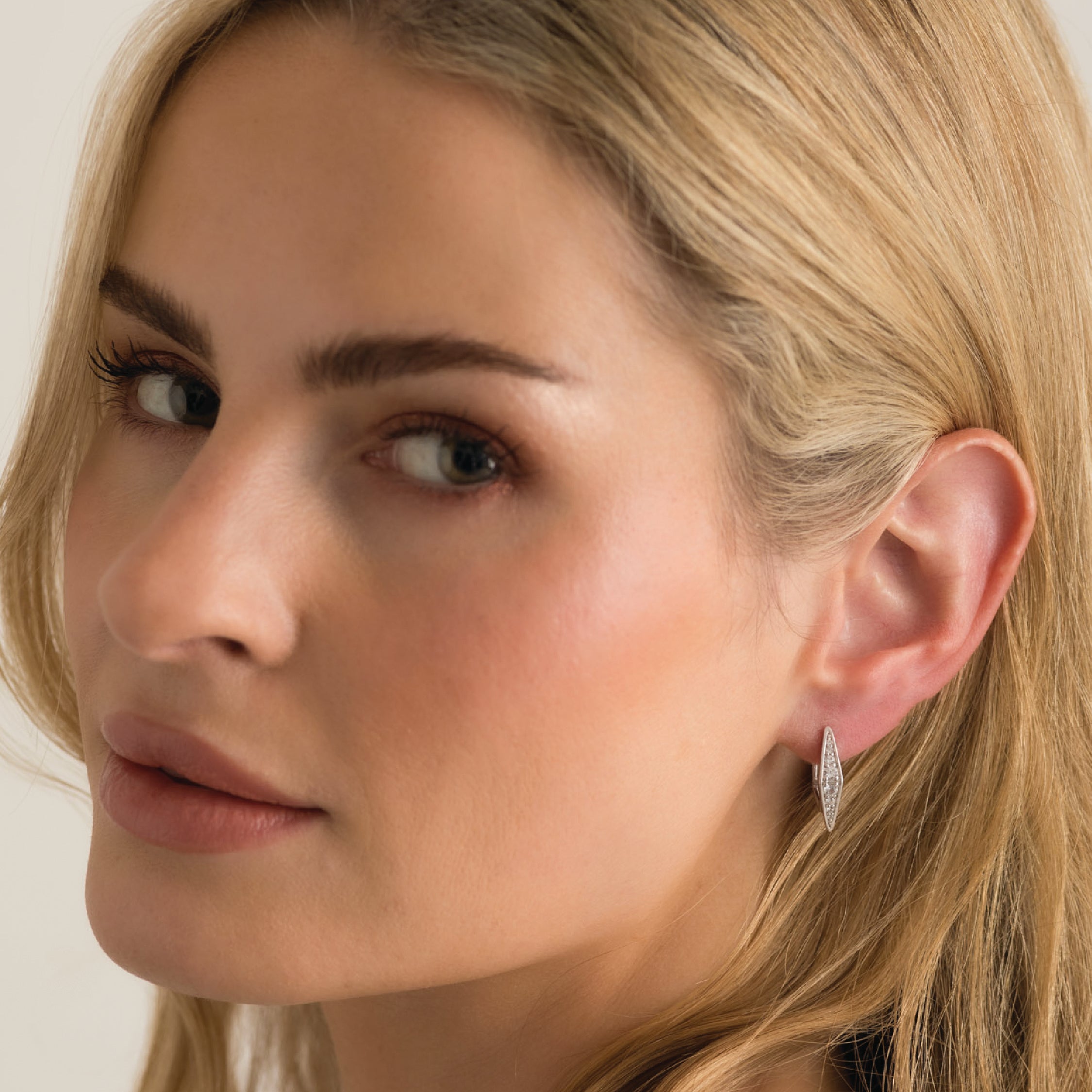 14K solid gold earrings with white diamonds and lever back closure, elegant and sleek design.