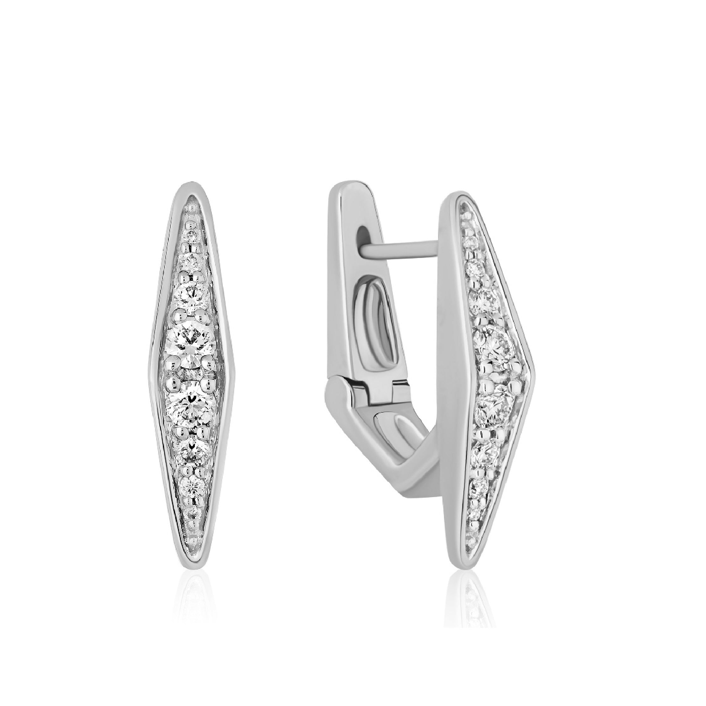 Close-up of 14K solid gold diamond earrings on a woman's ear, showcasing elegant design.