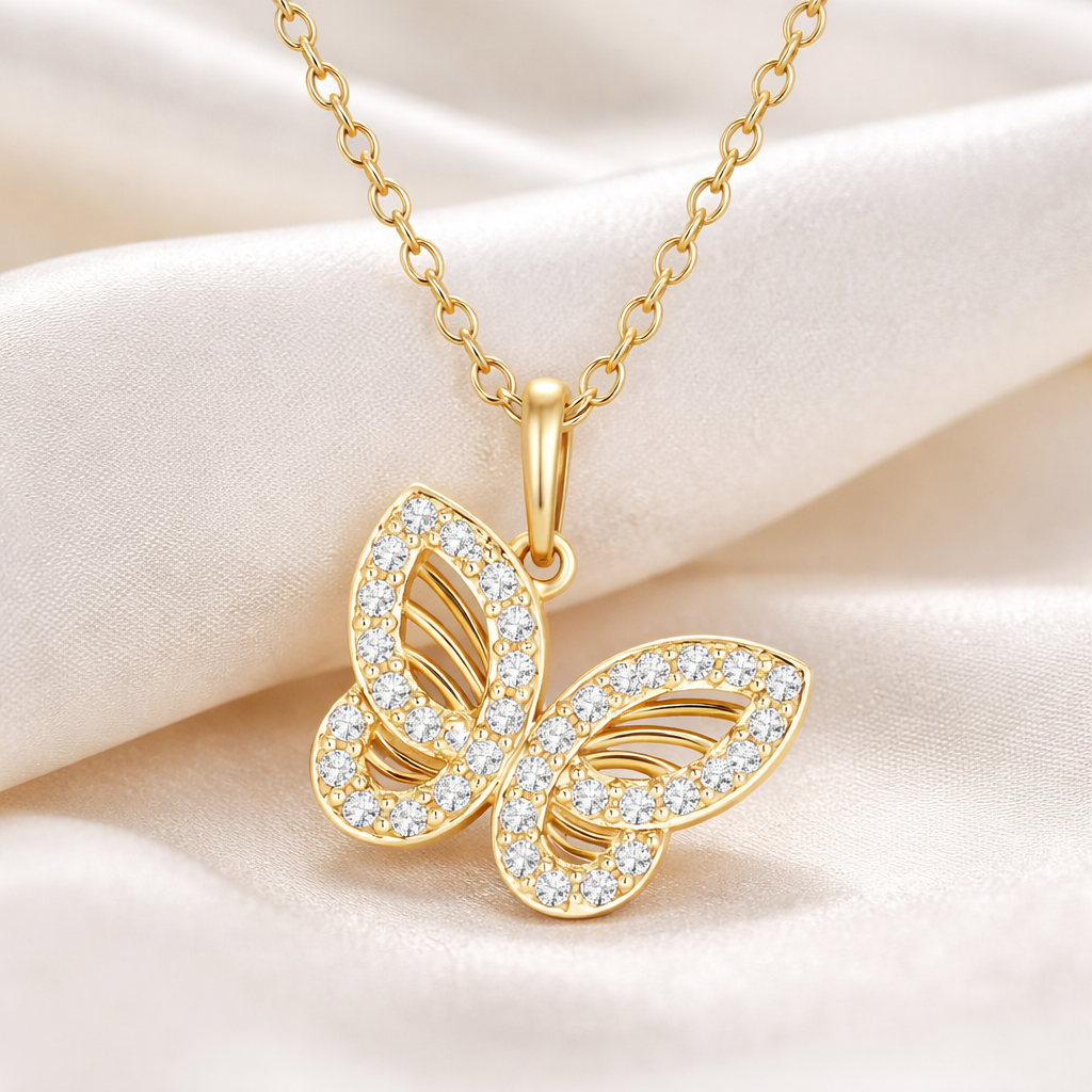 Gold butterfly necklace with diamonds on a soft beige background