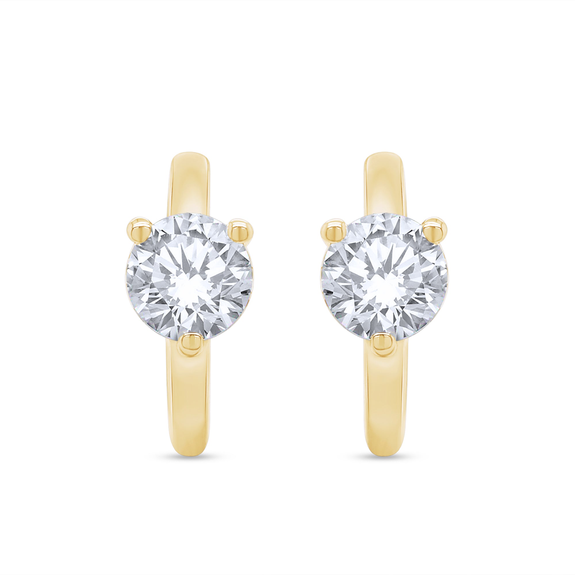 Gold earrings with clear gemstones on a white background