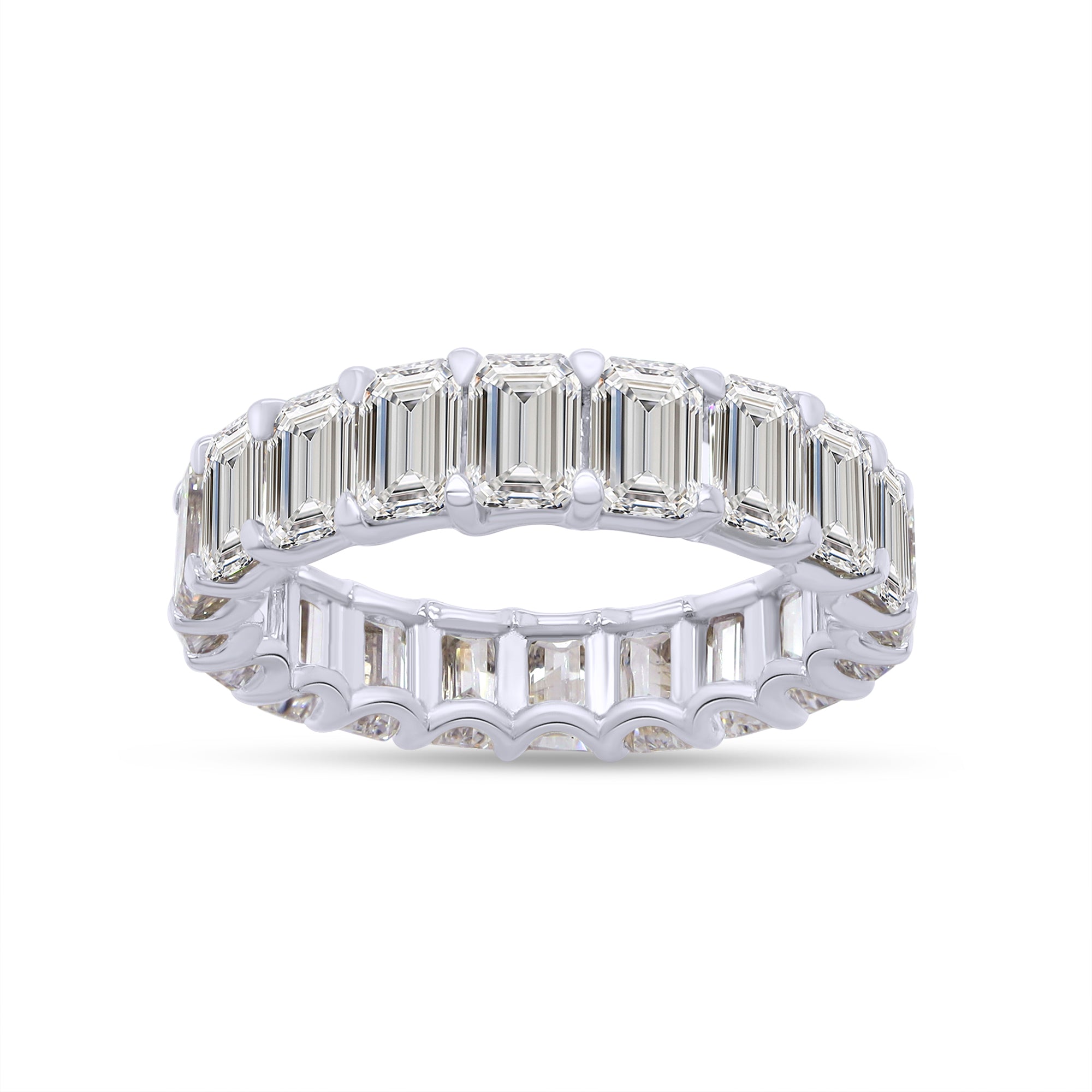 Diamond ring with emerald-cut stones on a white background