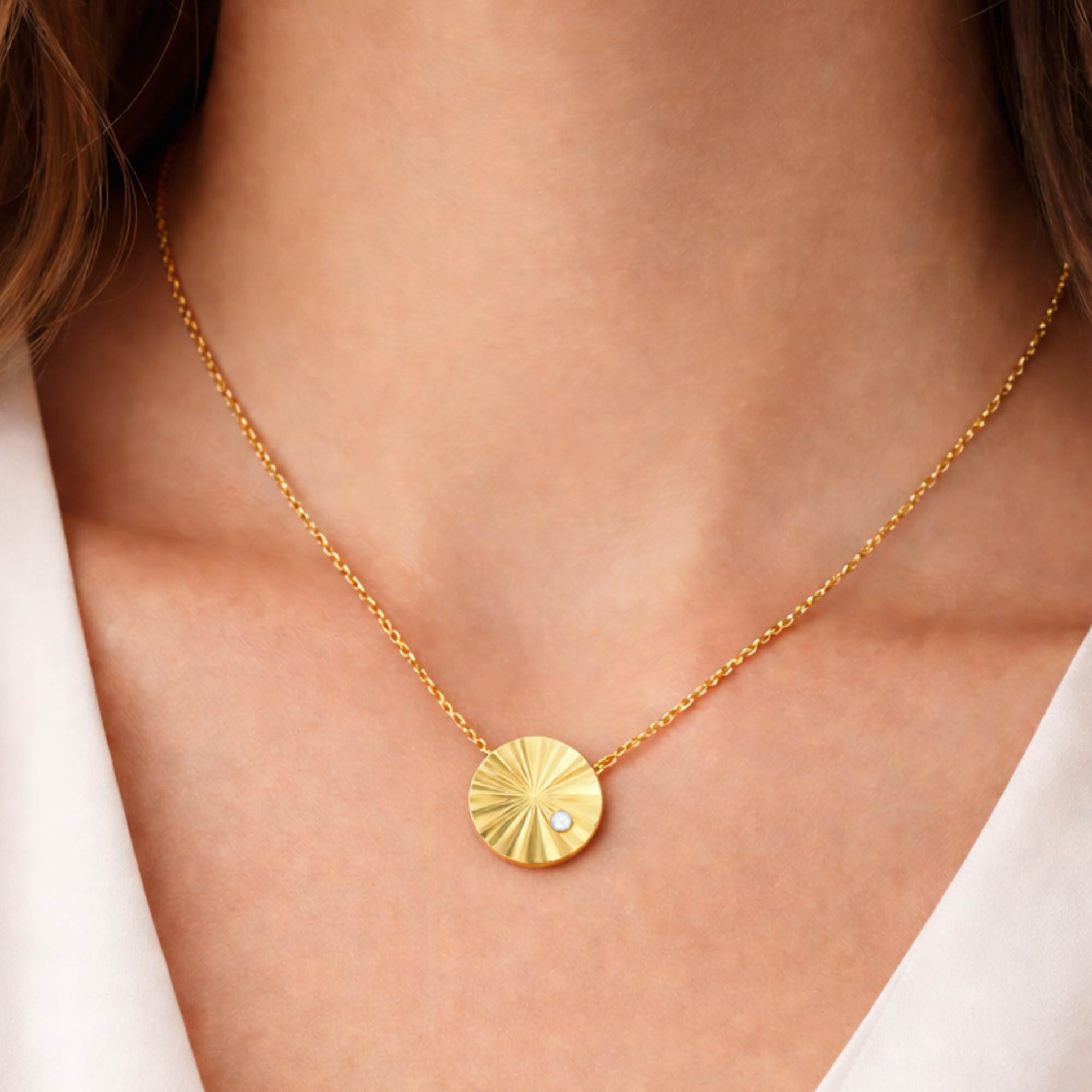 14k gold vermeil liv sunburst necklace with a single lab grown diamond on model