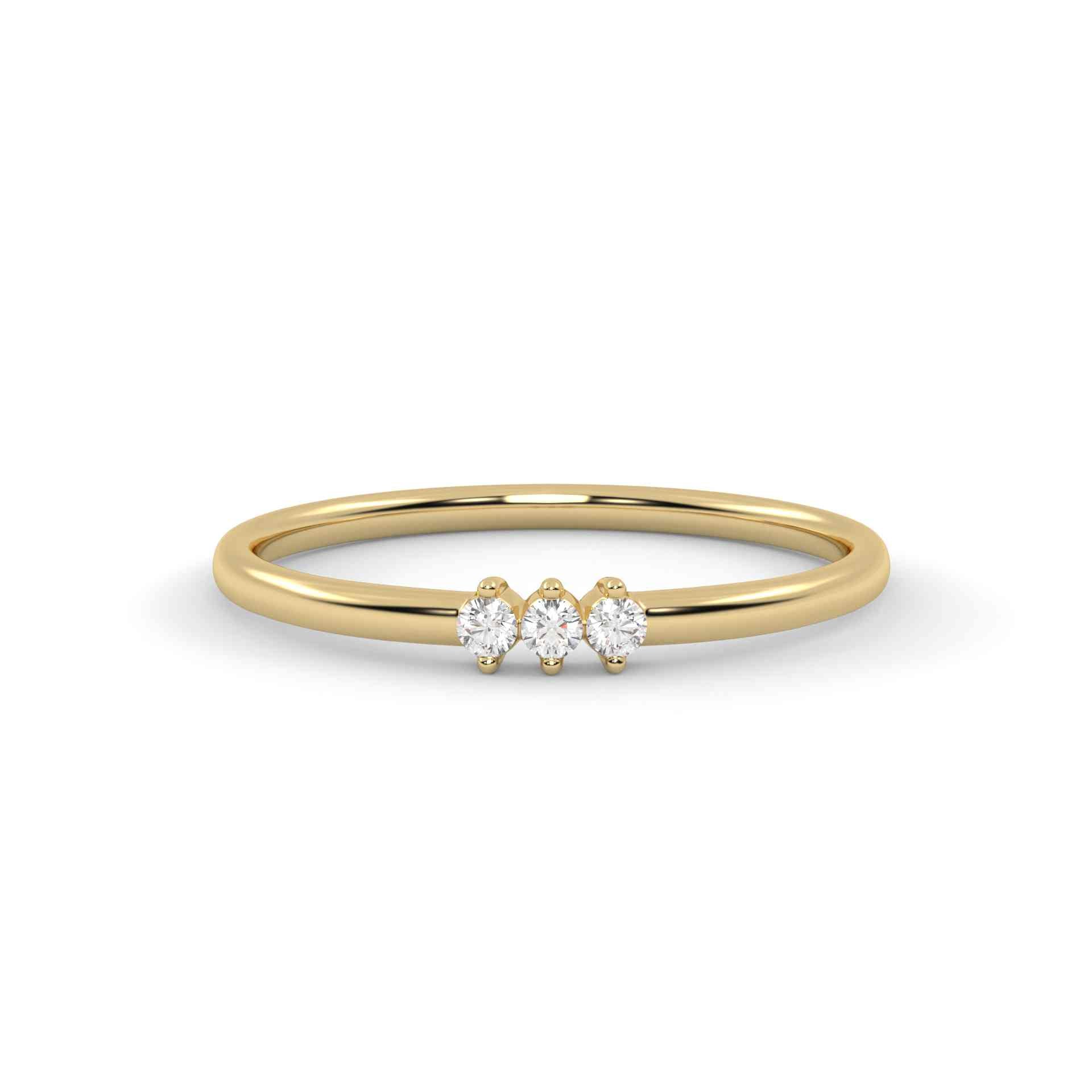 Gold ring with three diamonds on a white background
