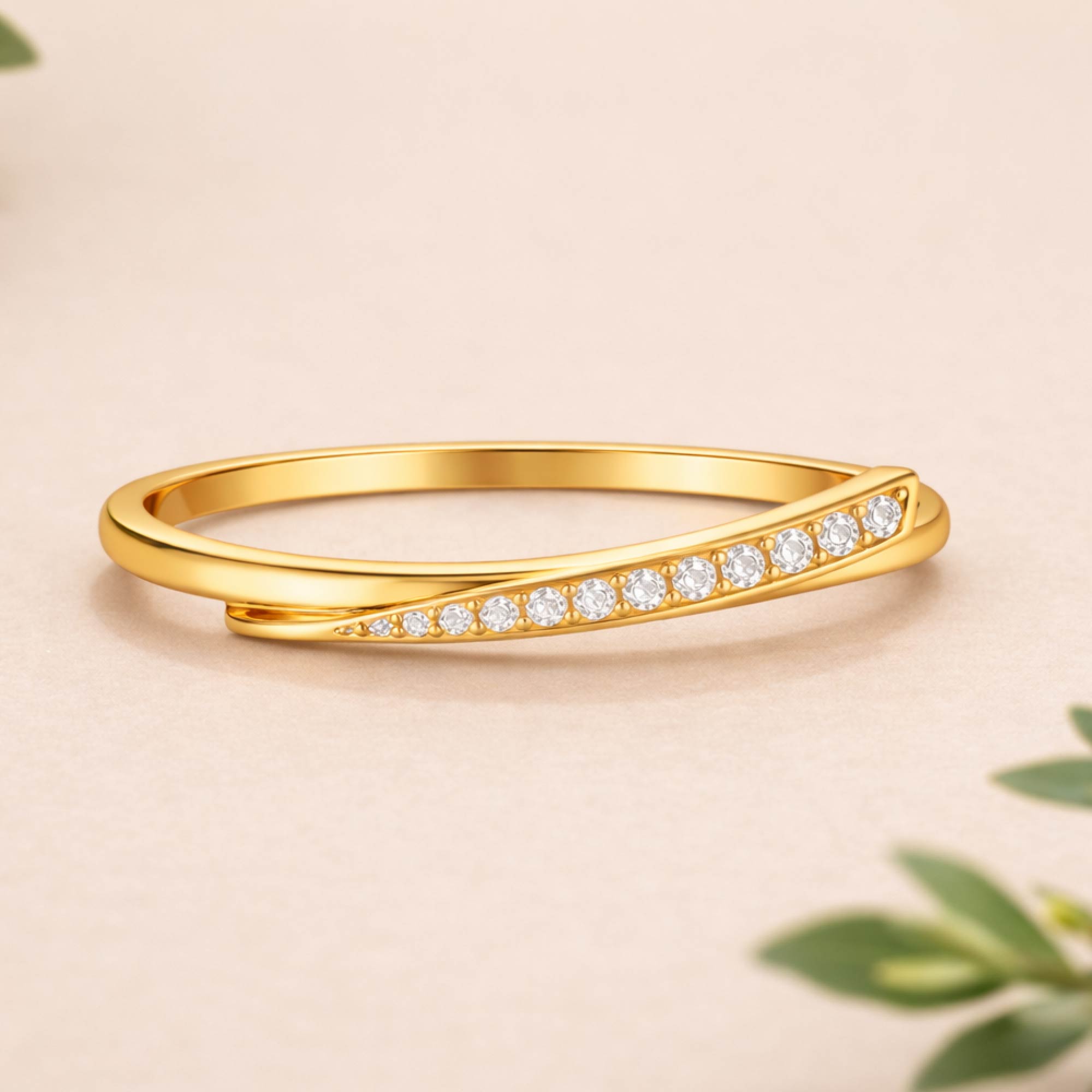 Gold ring with diamonds on a beige background