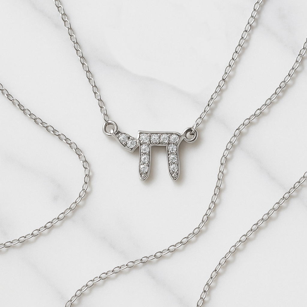 Silver necklace with a unique pendant on a white background
