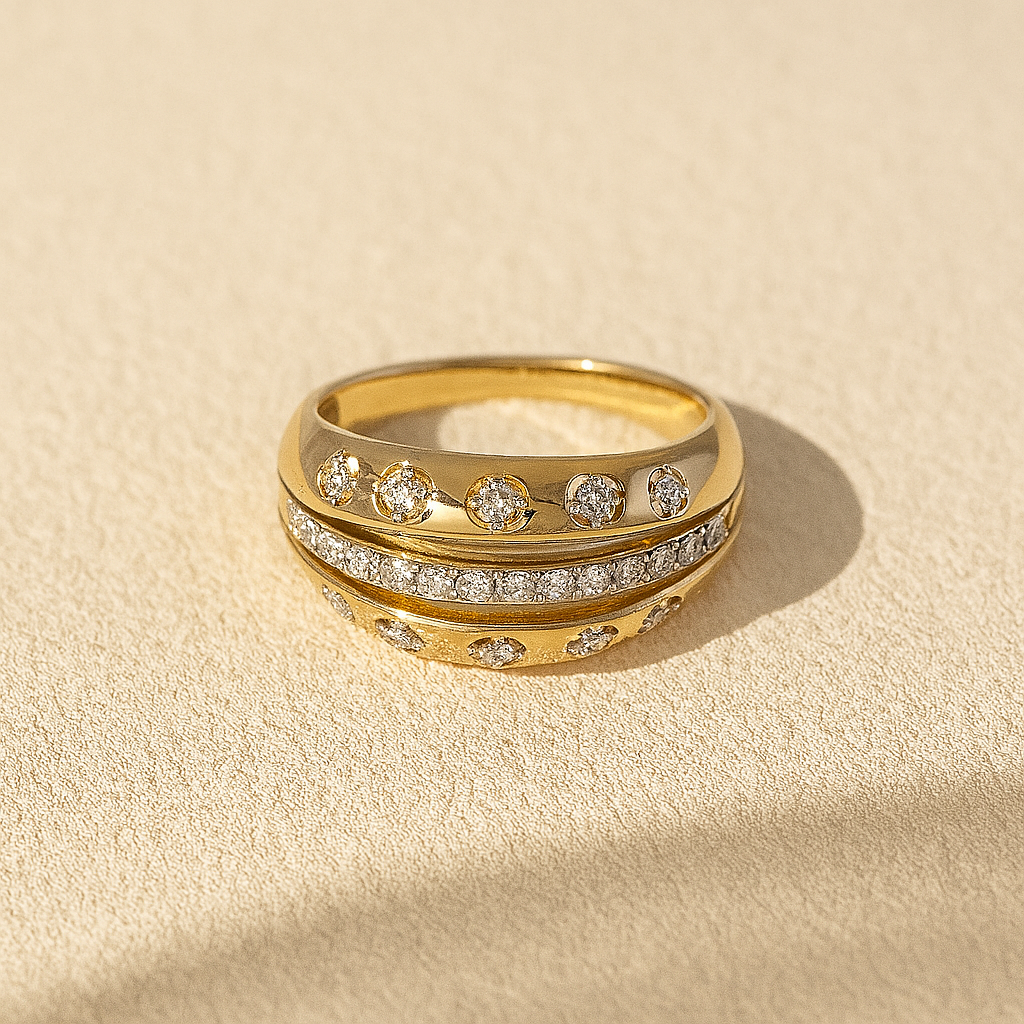 Solid Gold Dome Diamond RIng on a beige background
