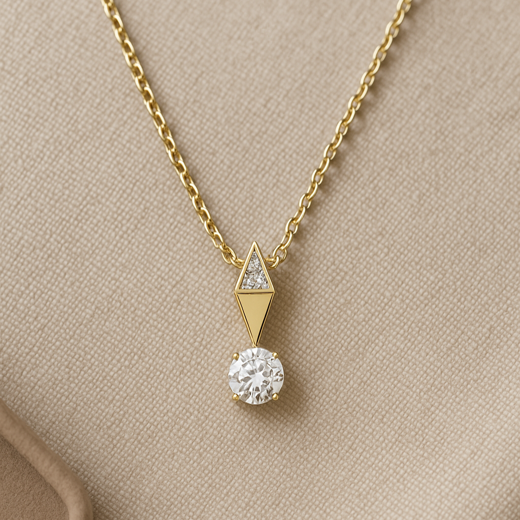 Gold necklace with a diamond pendant on a beige background