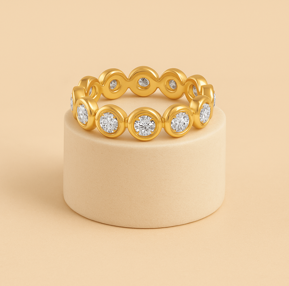 Gold ring with diamonds on a beige stand against a beige background