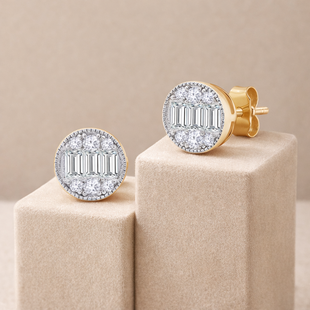 Gold and diamond earrings on a beige stand with a beige background