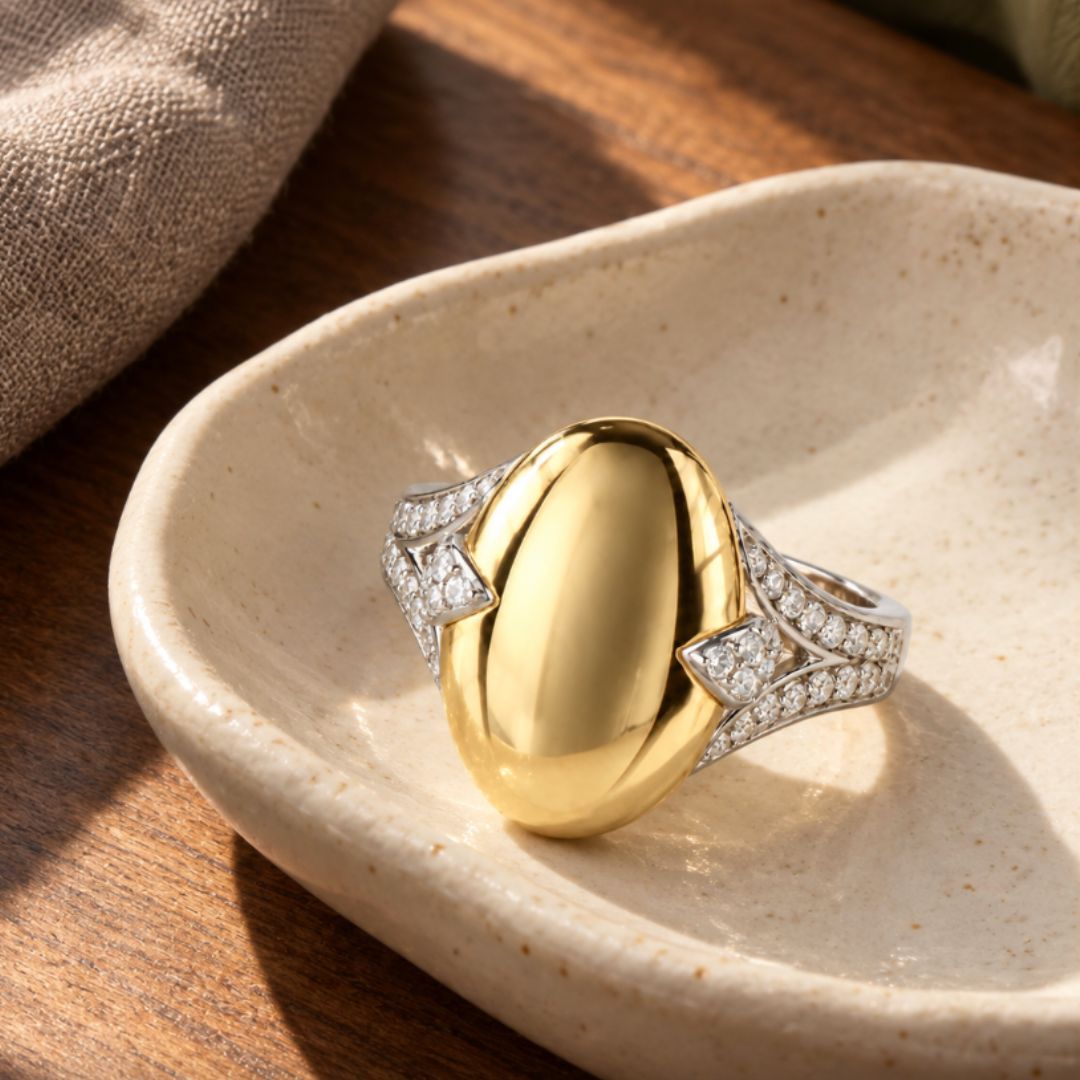 The Bean ring in mixed metals with gold vermeil and lab diamonds on a tray