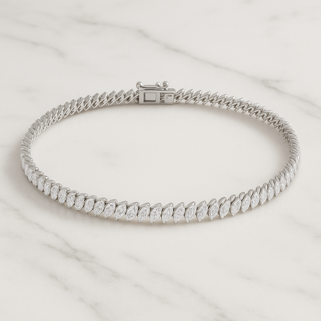 Silver bracelet with clear stones on a light marble background