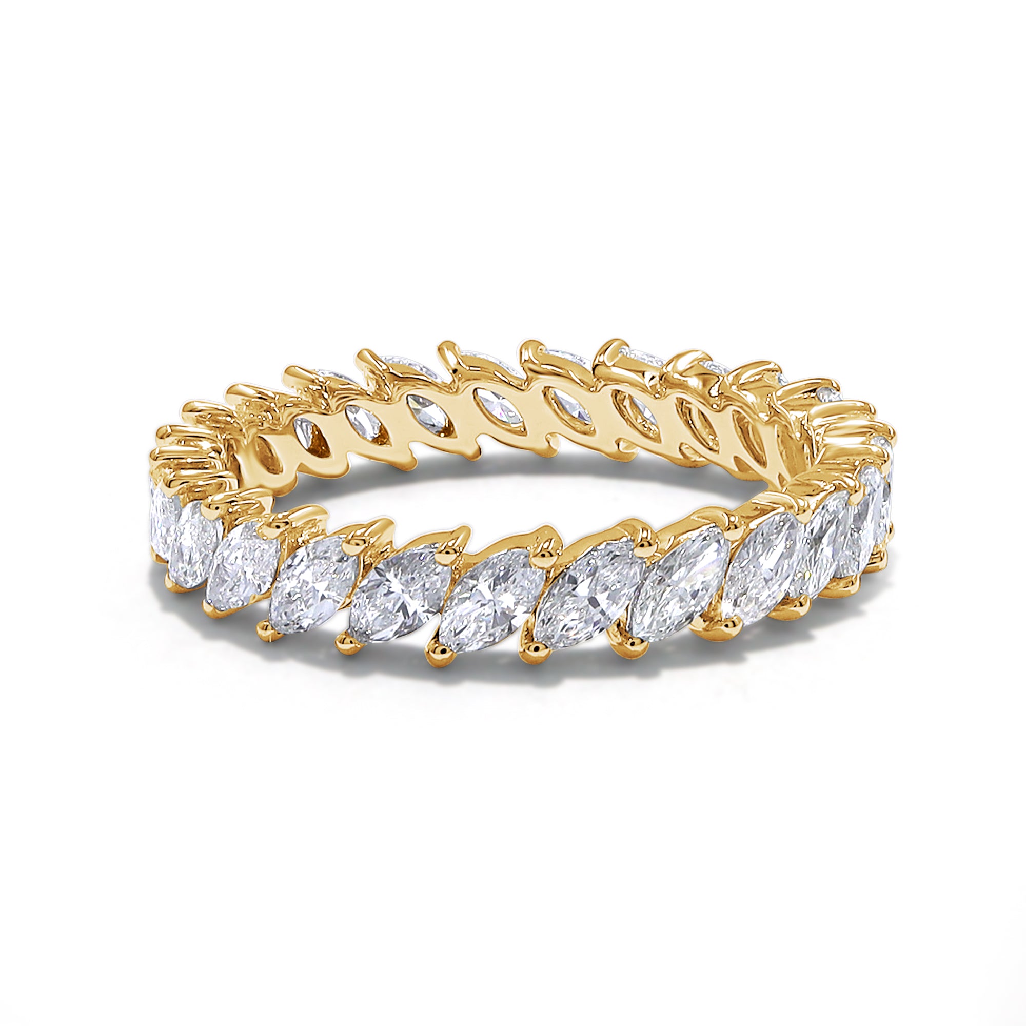 Gold ring with marquise-shaped diamonds on a white background