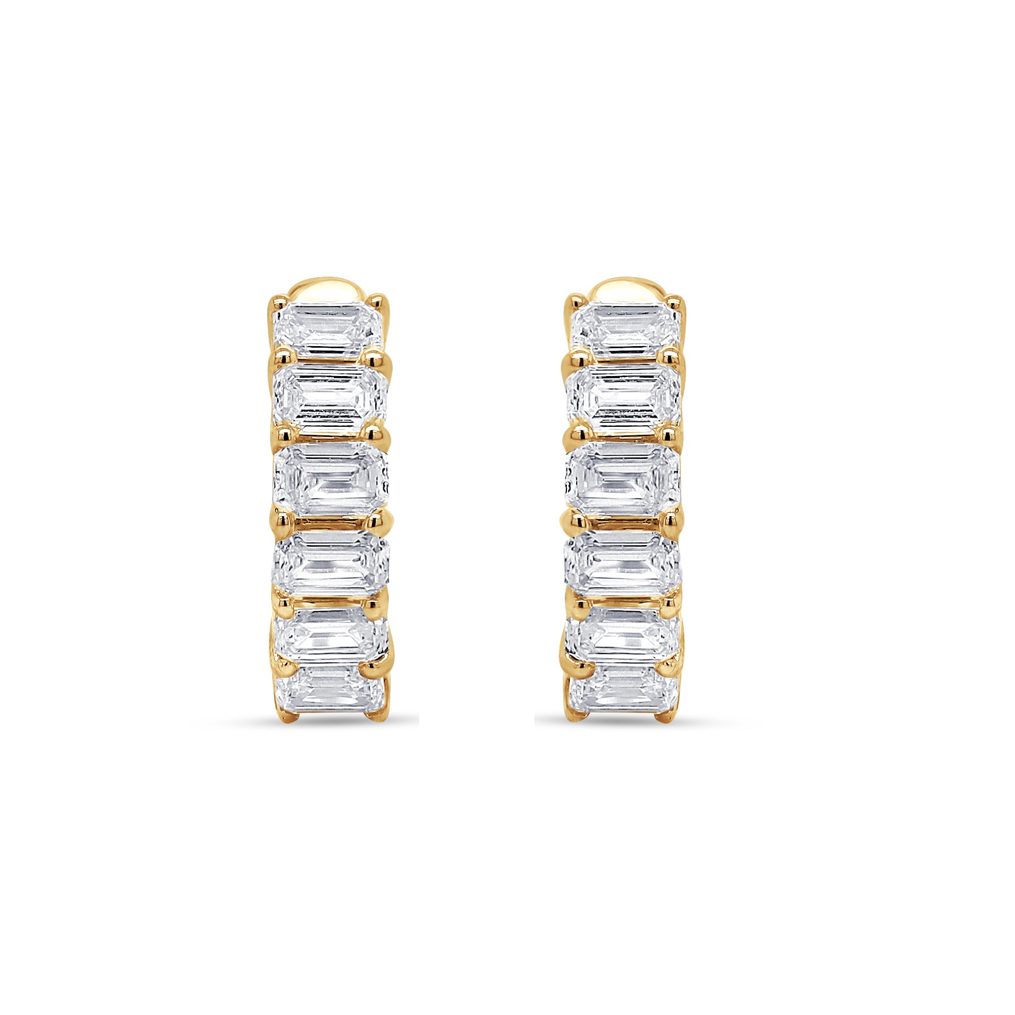 Gold hoop earrings with emerald-cut gemstones on a white background