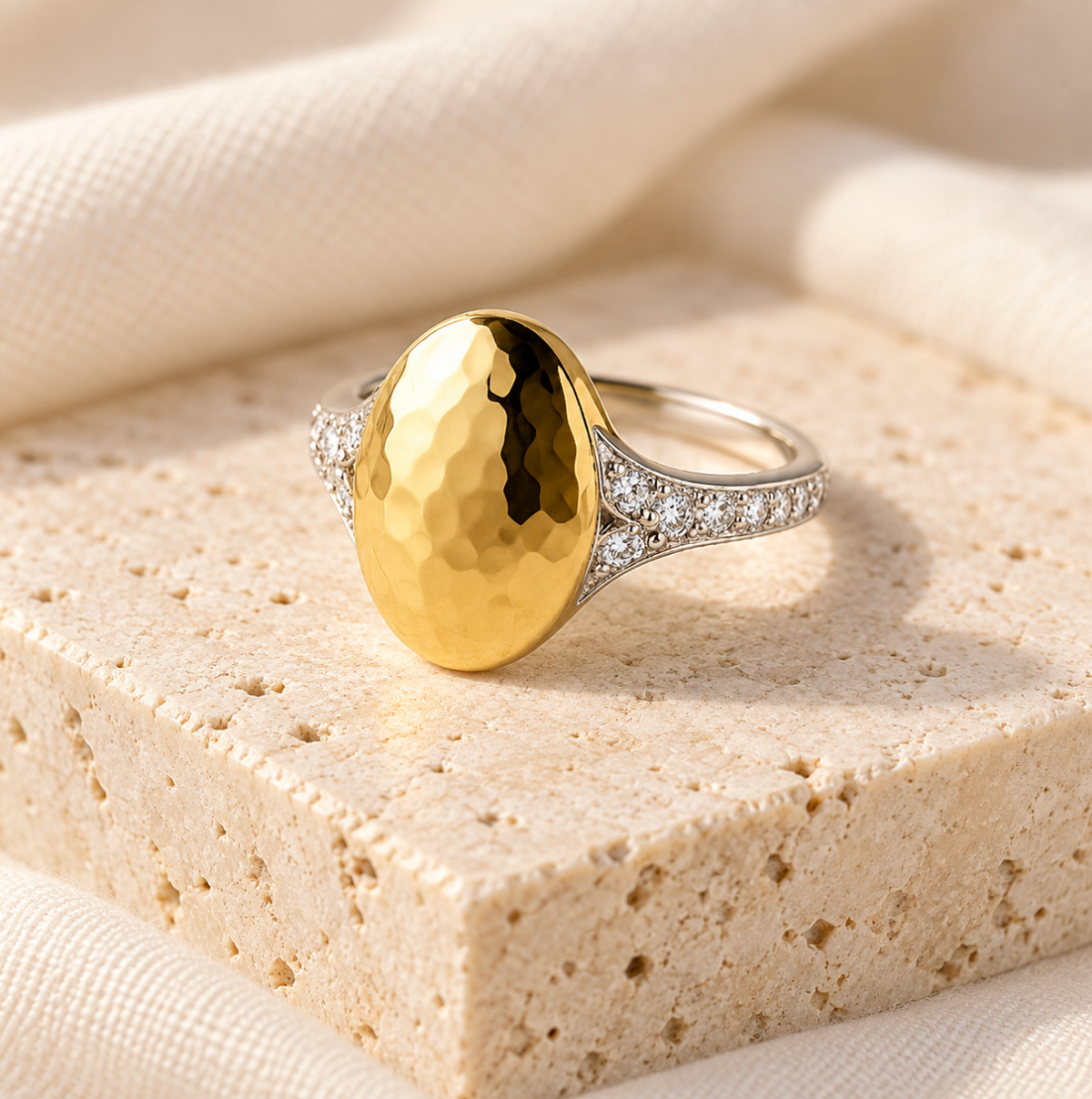 the asher hammered ring on a marble slab