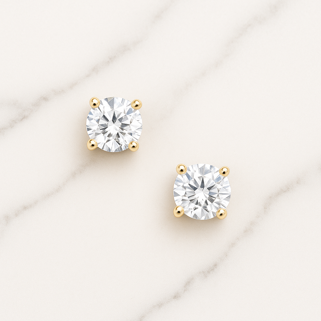 Pair of diamond stud earrings on a light background