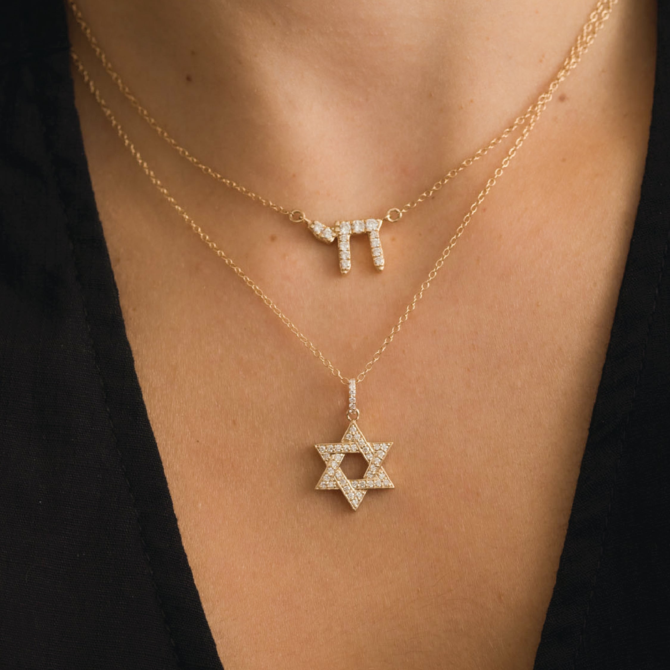 14K gold Star of David necklace with diamonds on a delicate chain.