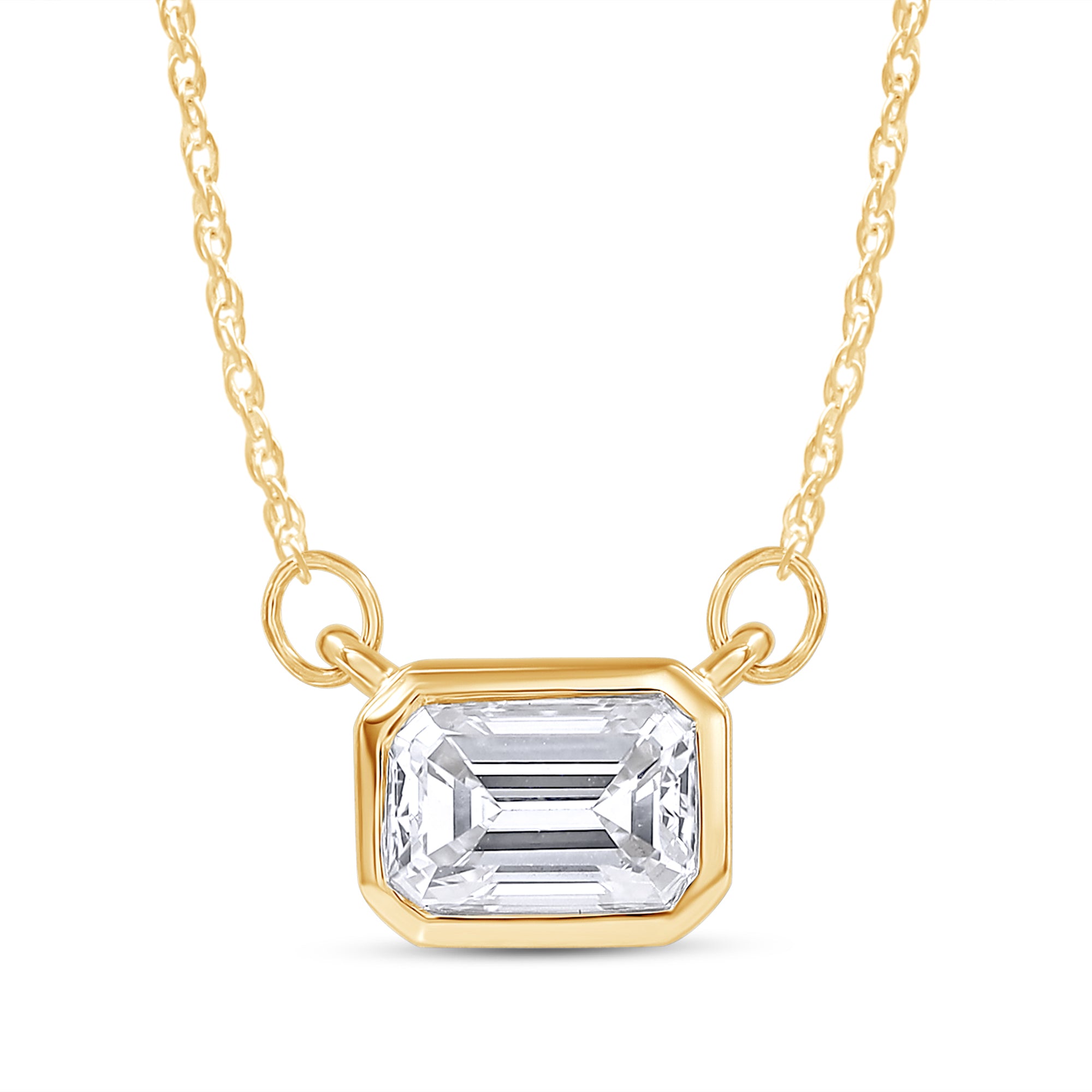 Gold necklace with a clear gemstone pendant on a white background