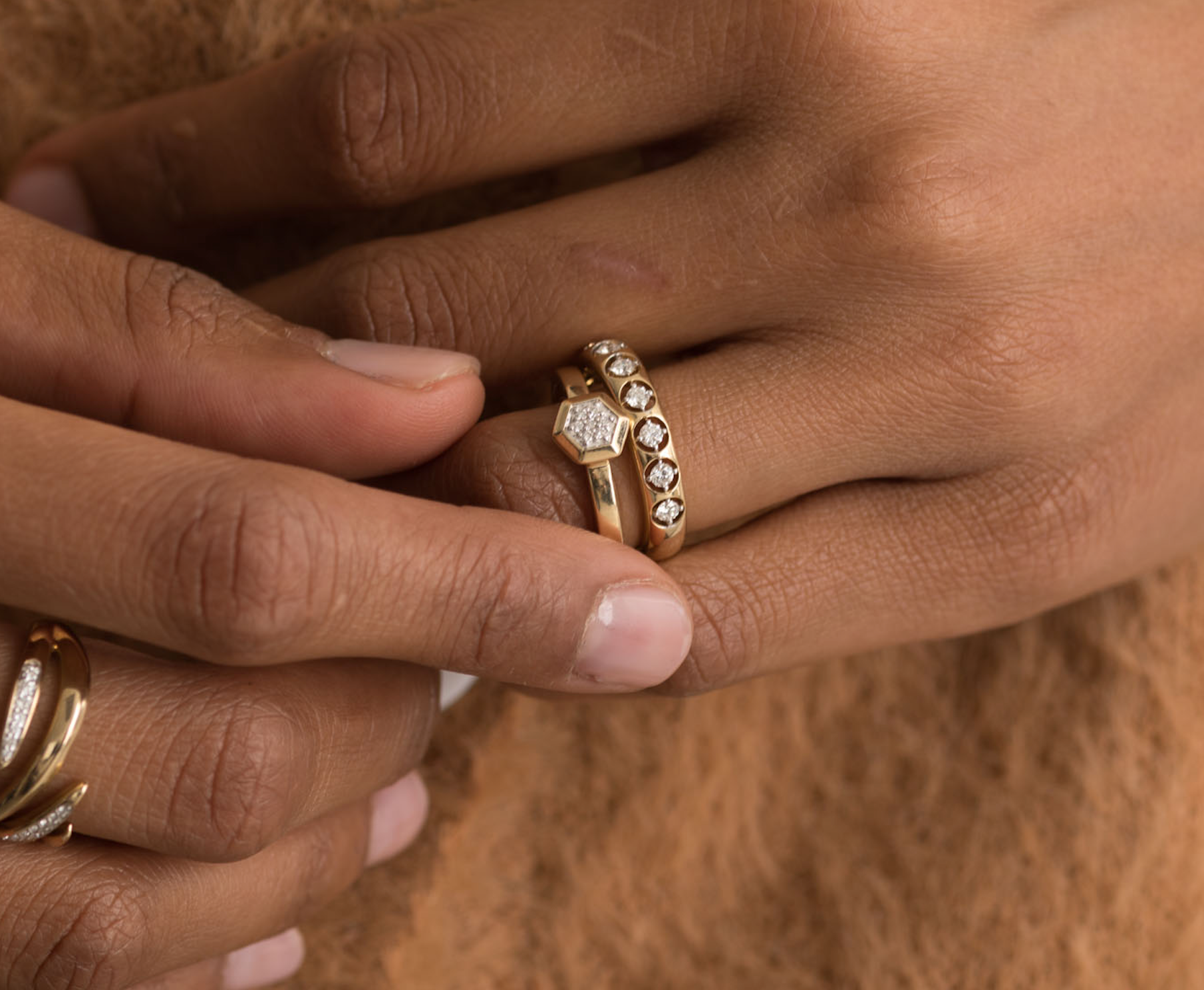 14K gold ring with hexagon diamond on a hand, elegant and stylish.