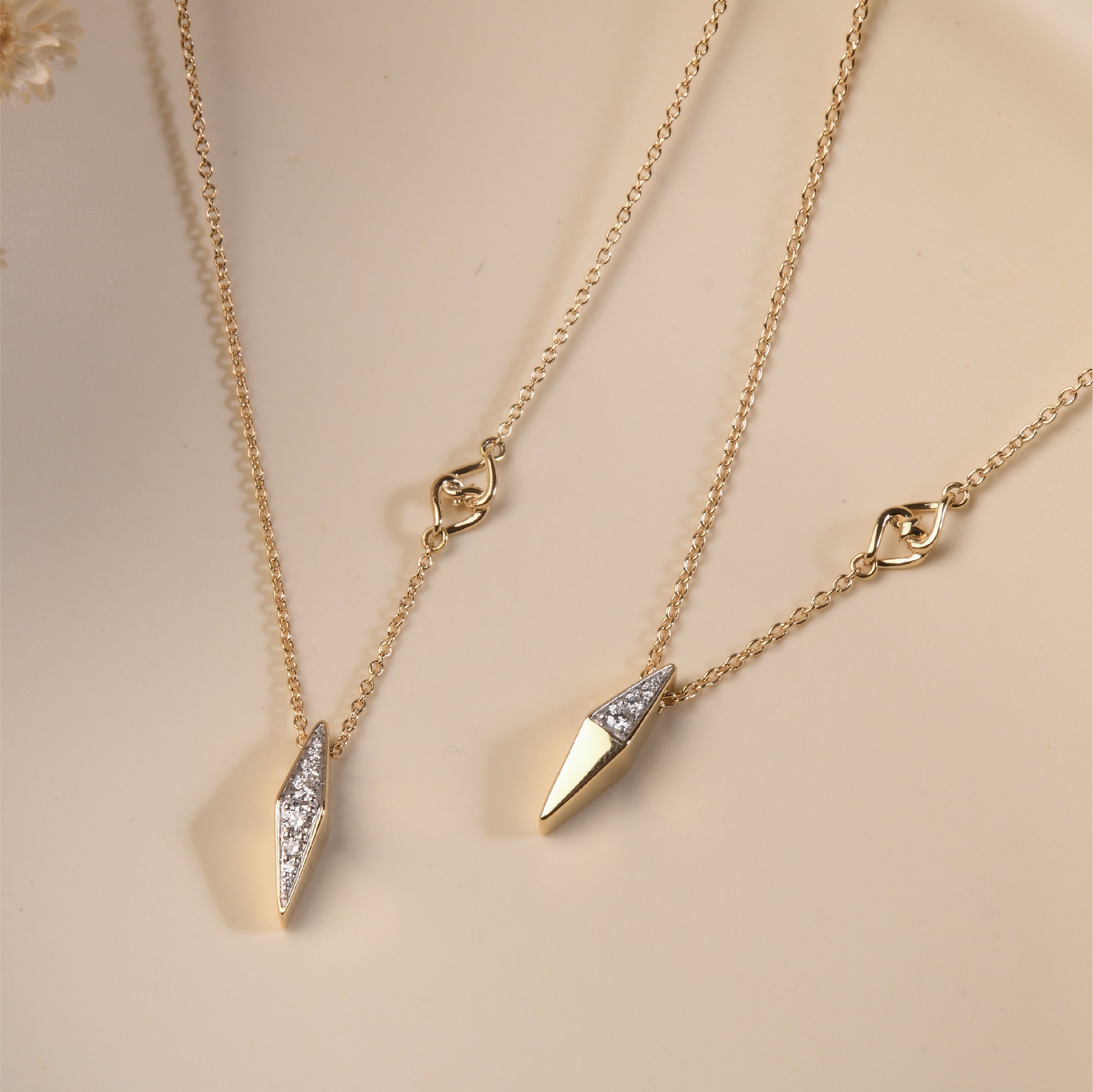 14K solid gold necklace with white diamond pendant and cable chain.