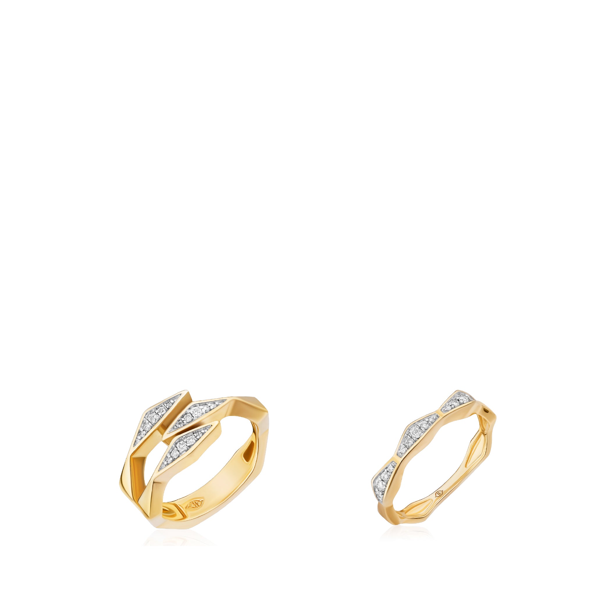 Solid 14K gold rings with diamond accents, featuring a modern geometric design.