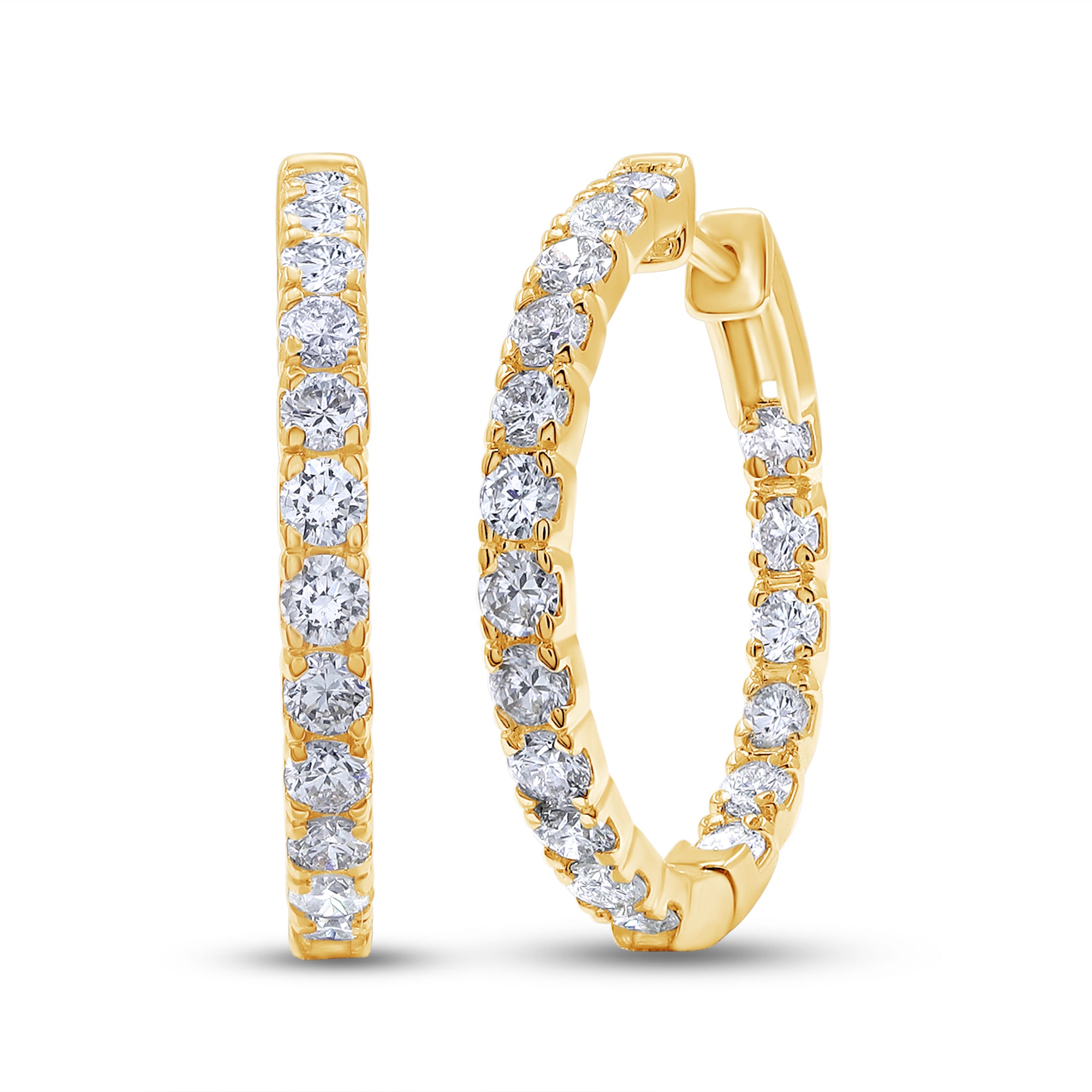 Gold hoop earrings with clear gemstones on a white background