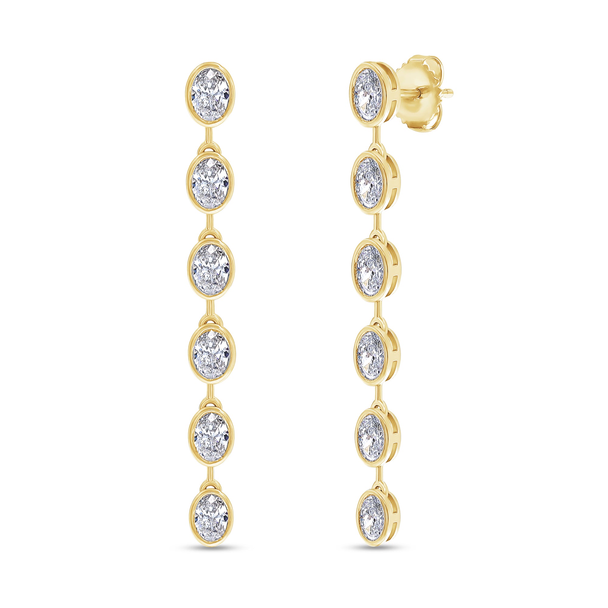 Gold earrings with clear gemstones on a white background