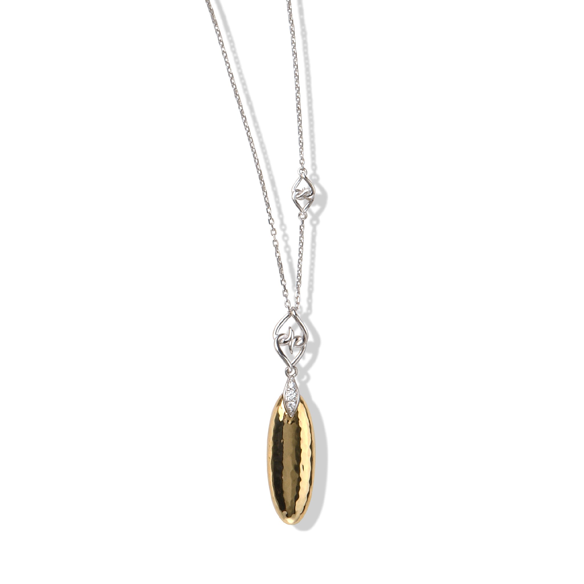 Gold and silver gemstone pendant necklace with hammered teardrop design on a delicate chain.