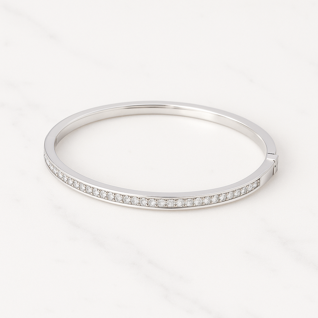 Silver bracelet with small stones on a white background