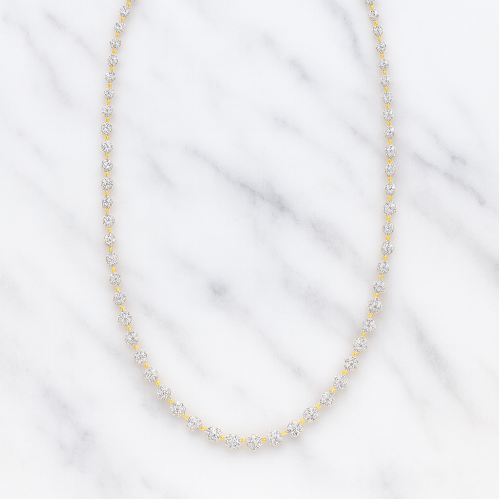 Pearl necklace on a white fabric background