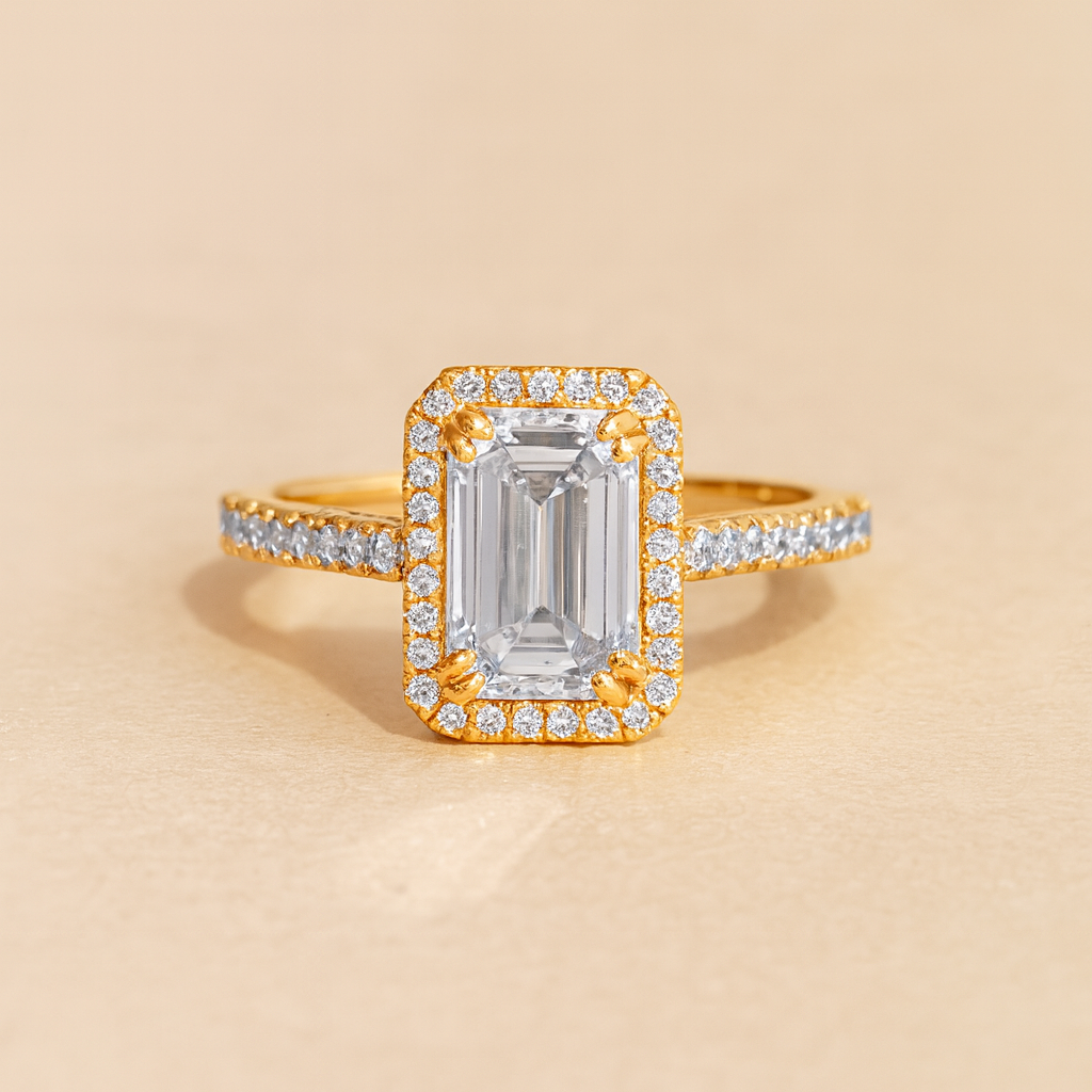 Gold ring with a large central diamond and smaller diamonds on a beige background