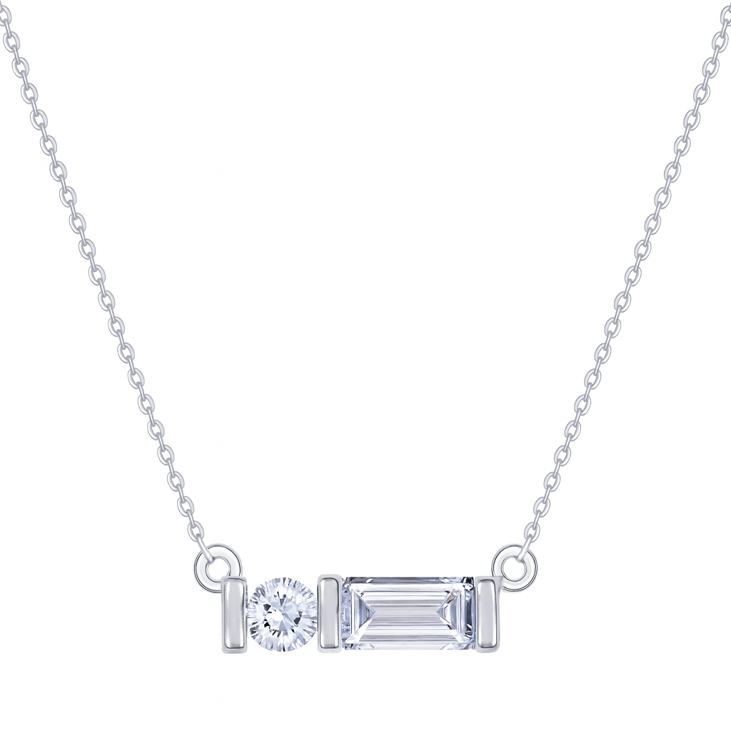 Diamond necklace with emerald-cut and round-cut gemstones on a white background