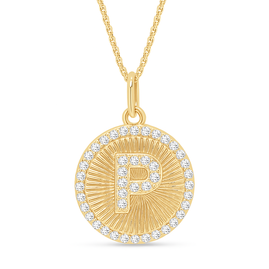 Gold necklace with a circular pendant featuring the letter 'P' and diamonds on a white background