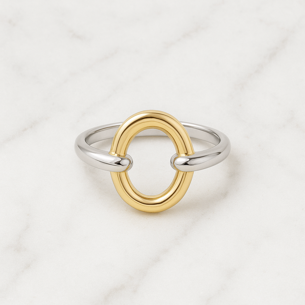 Two-tone ring with gold and silver loops on a light background