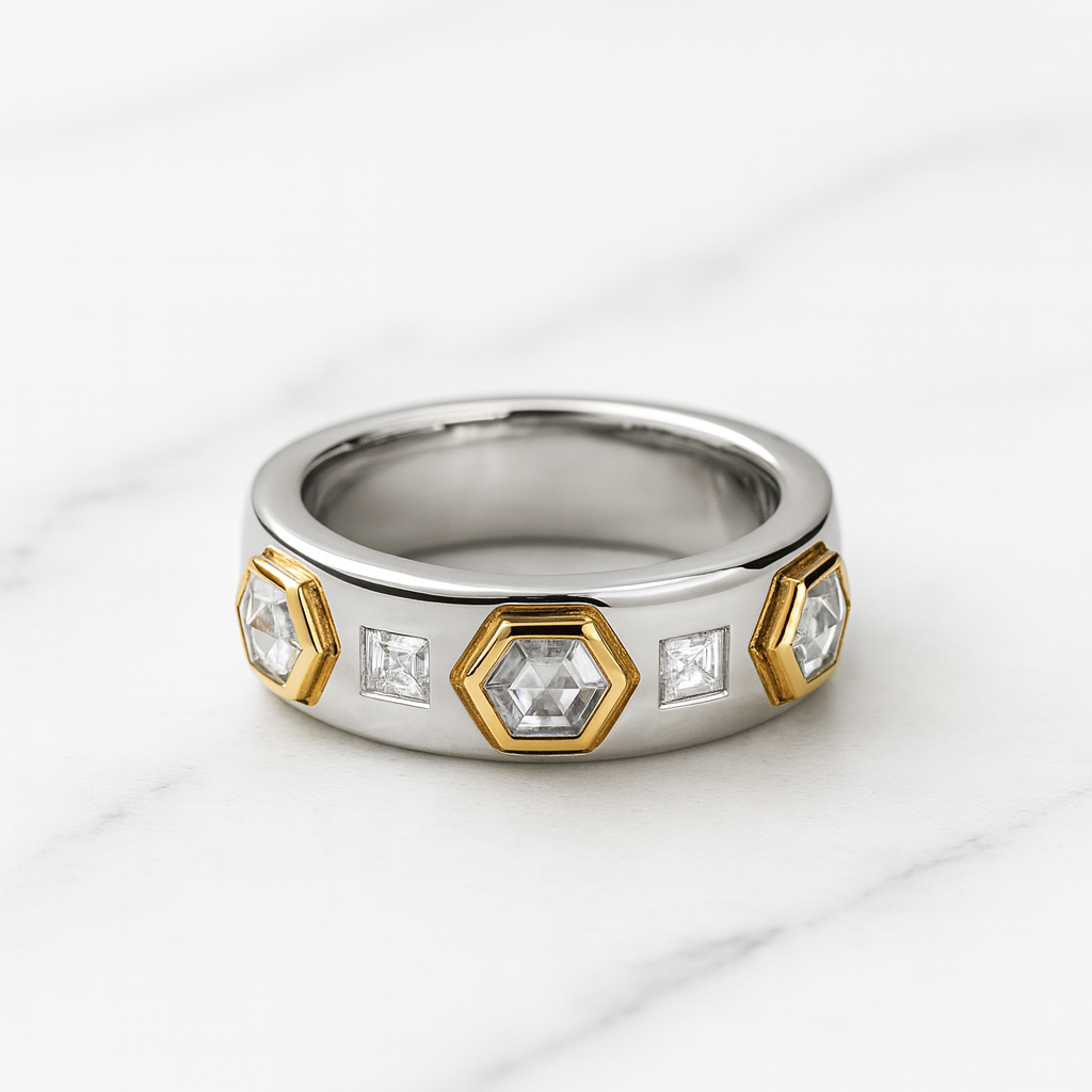 Silver ring with gold accents and embedded diamonds on a white background