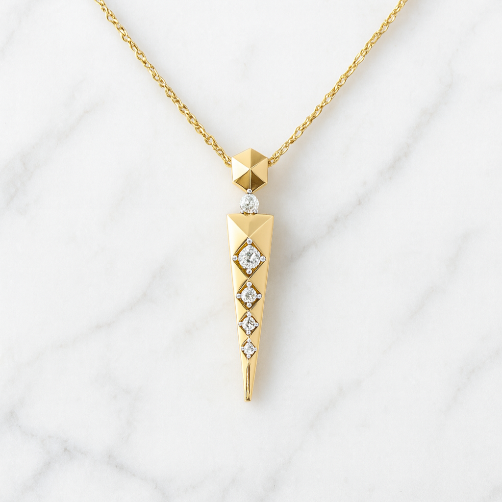 Gold necklace with a geometric pendant on a white background