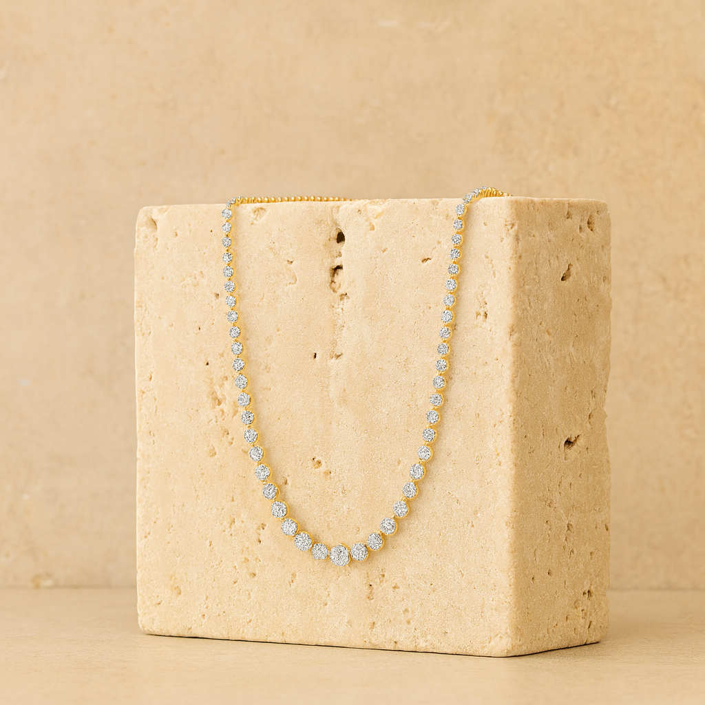 solid gold diamond necklace on a brick