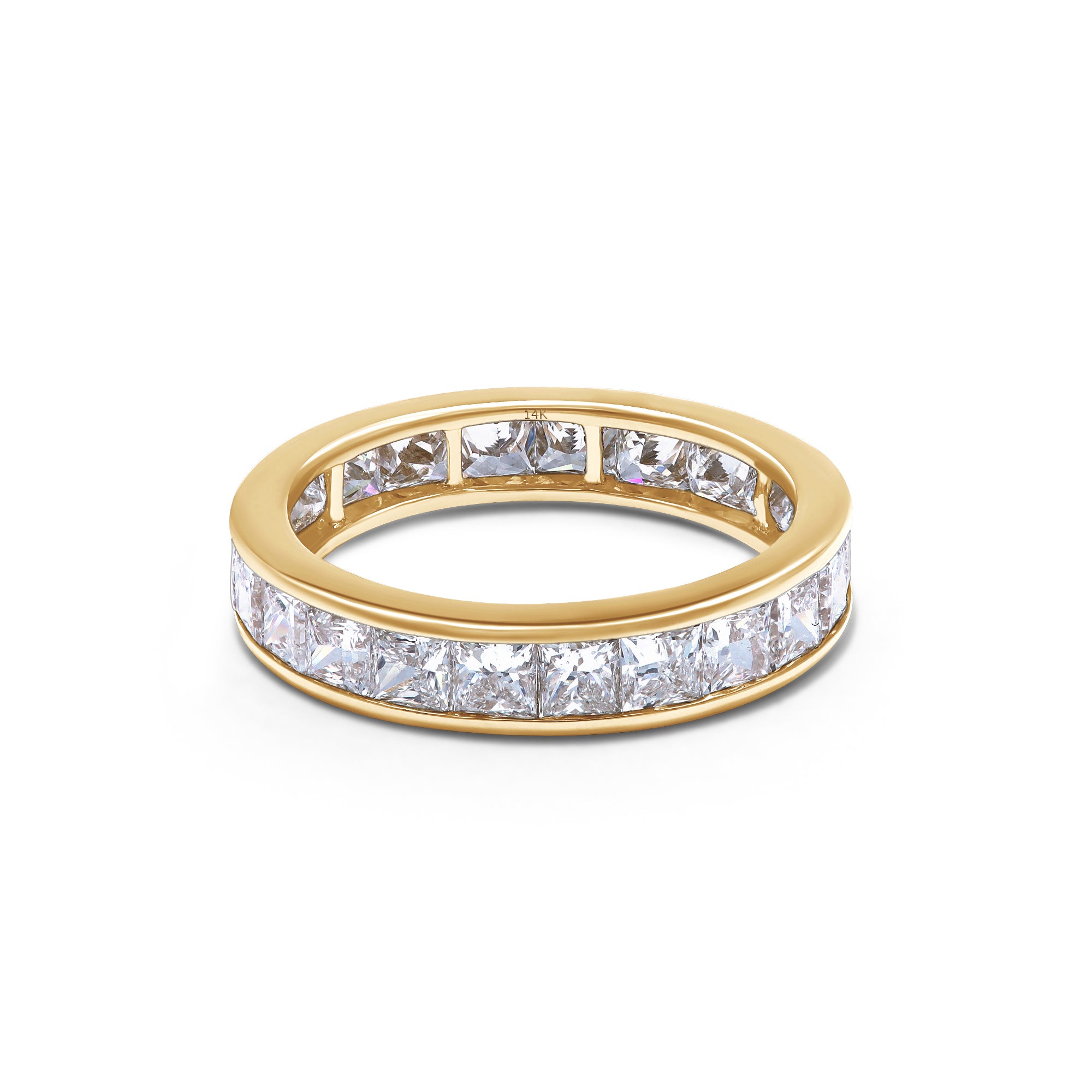 Gold ring with diamond stones on a white background