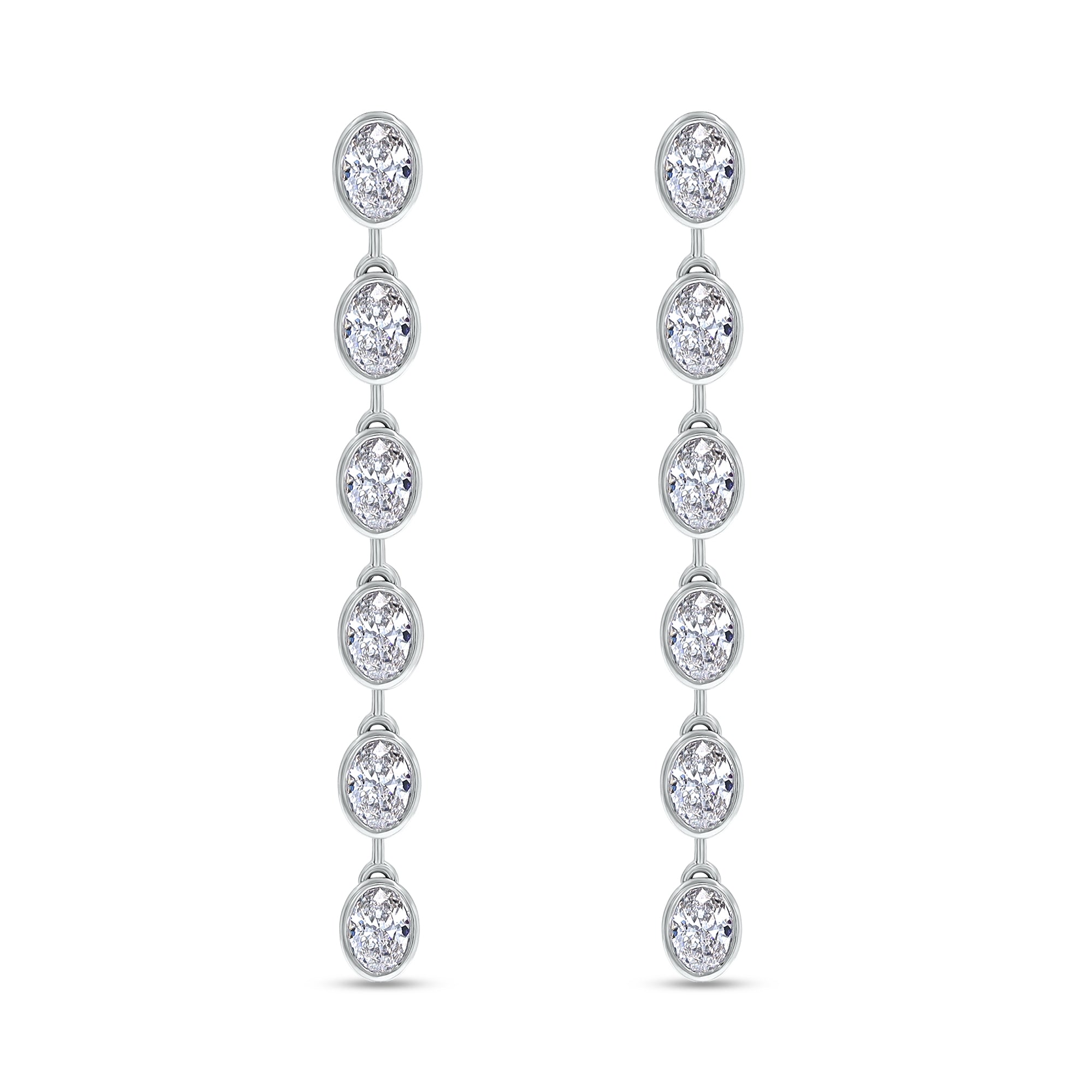 Pair of silver earrings with multiple round diamonds on a white background