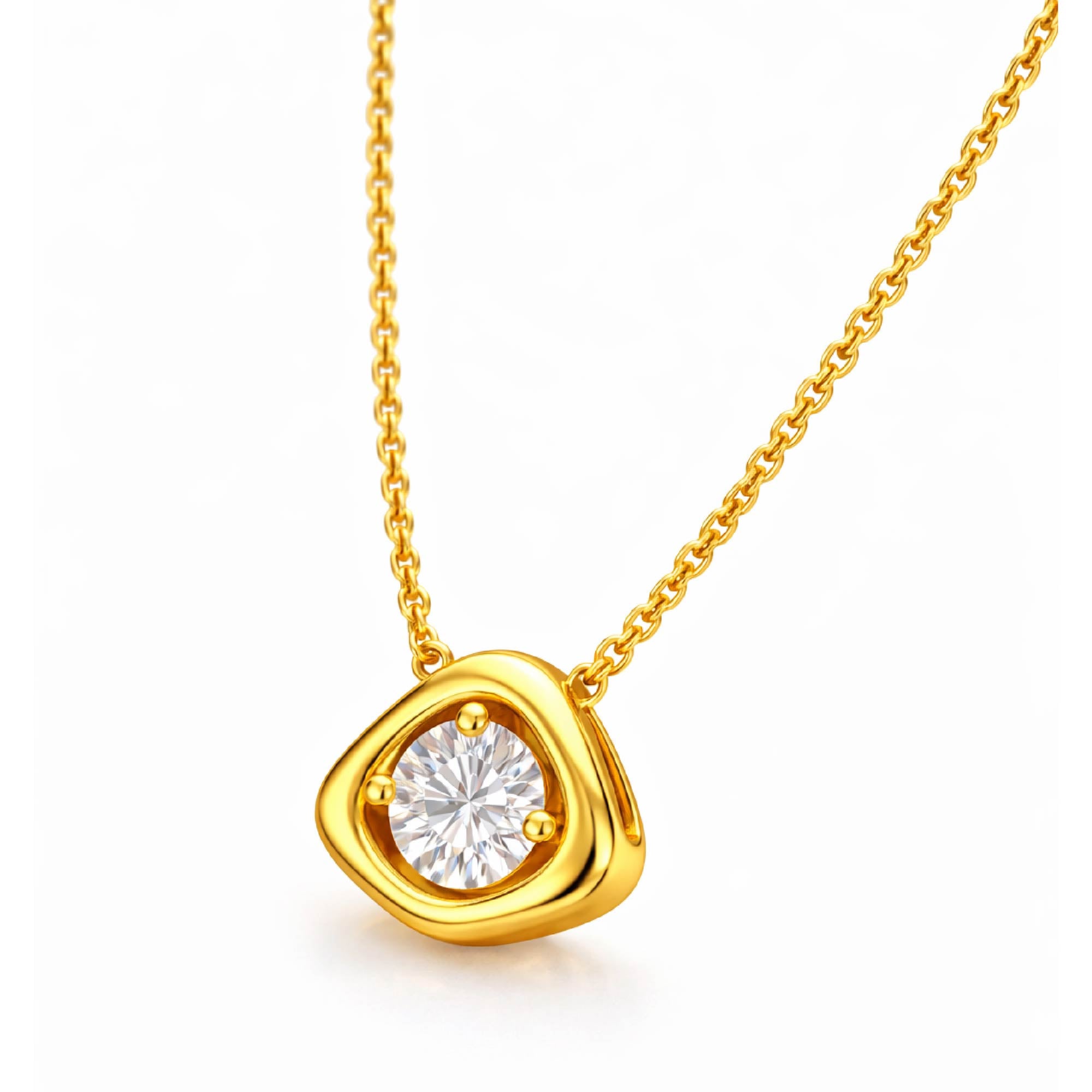 Gold necklace with a diamond pendant on a white background