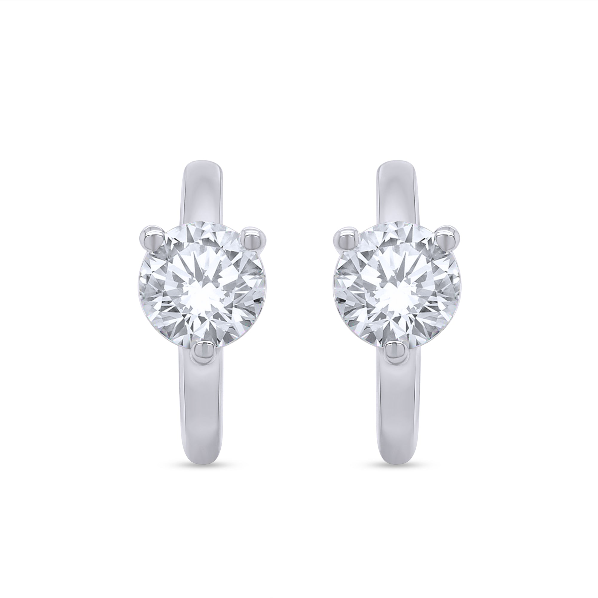 Pair of silver hoop earrings with clear gemstones on a white background