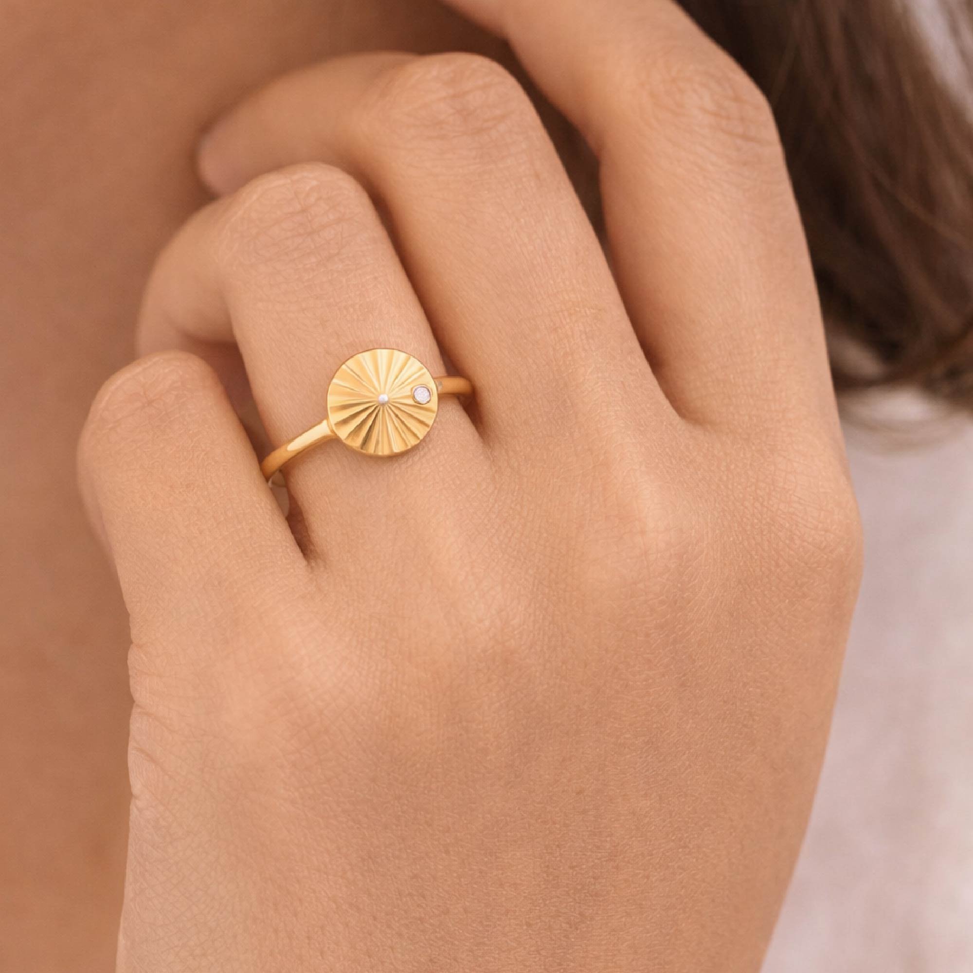 14k gold vermeil liv sunburst ring with a single lab grown diamond  on model 