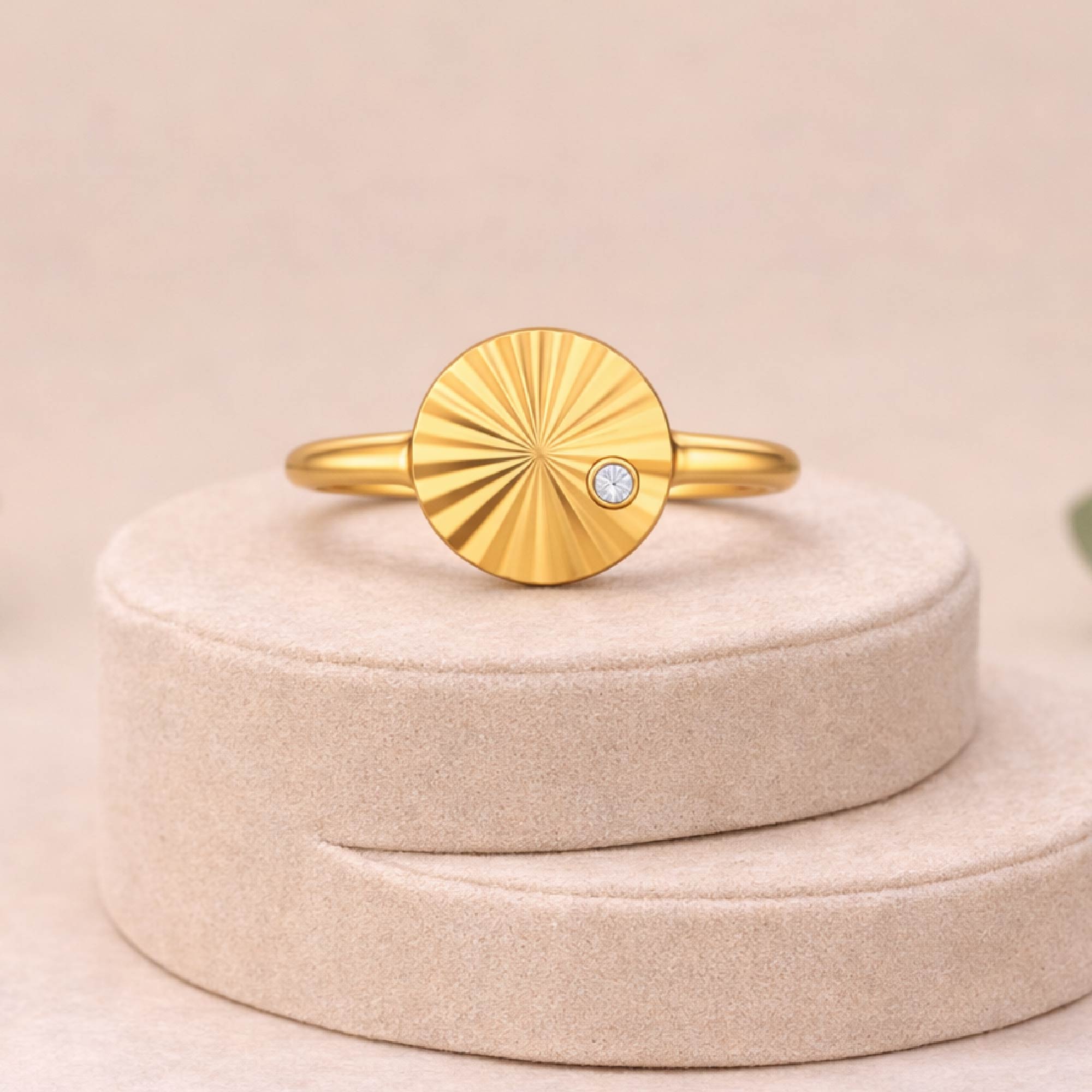 14k gold vermeil liv sunburst ring with a single lab grown diamond on a jewelry riser