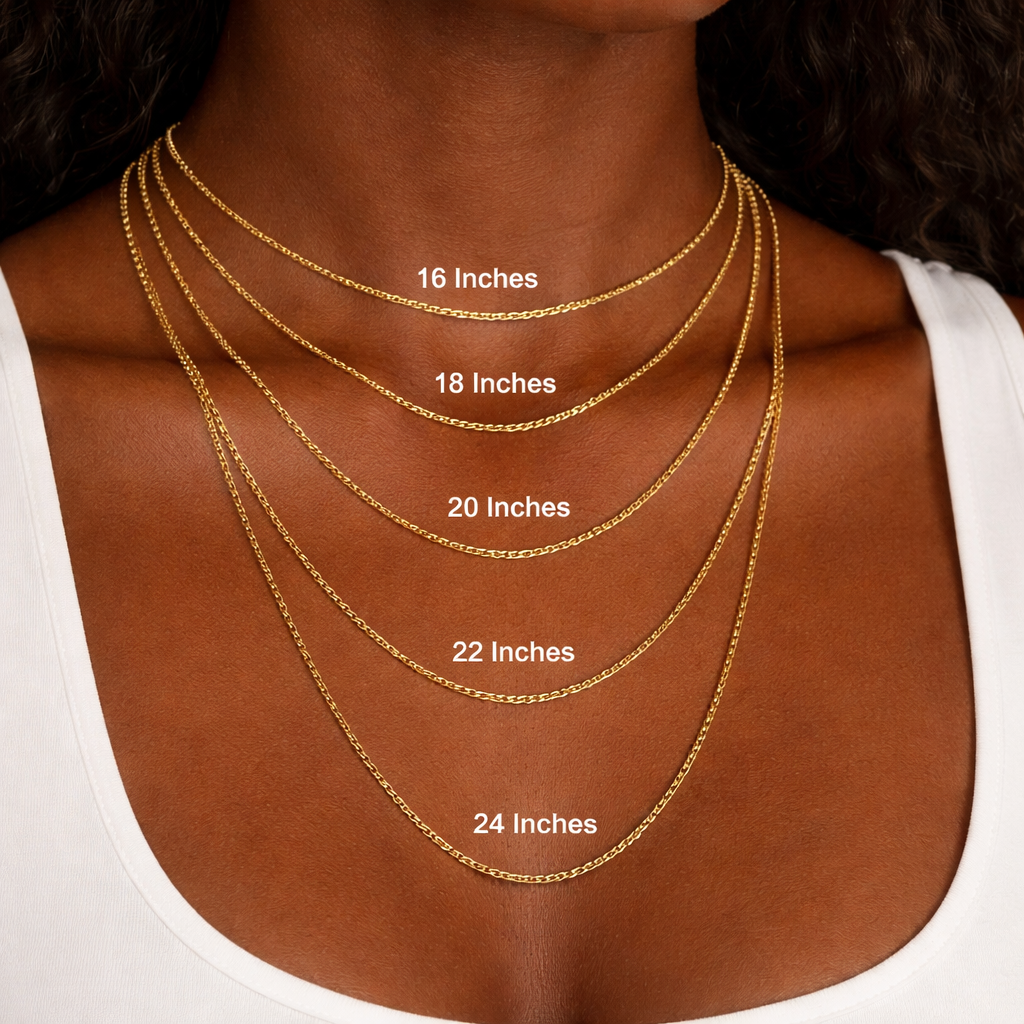 Gold necklaces of different lengths displayed on a person's neck.