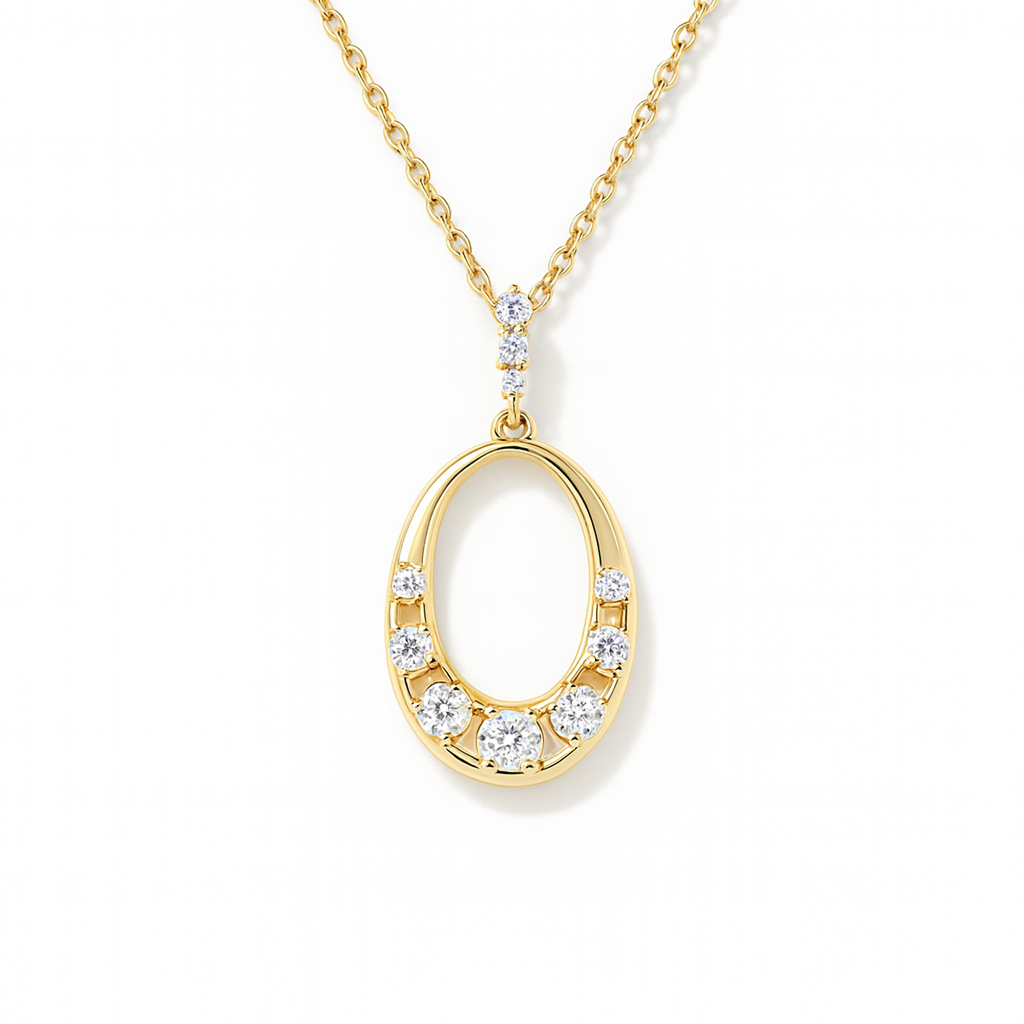 Gold necklace with an oval pendant on a white background