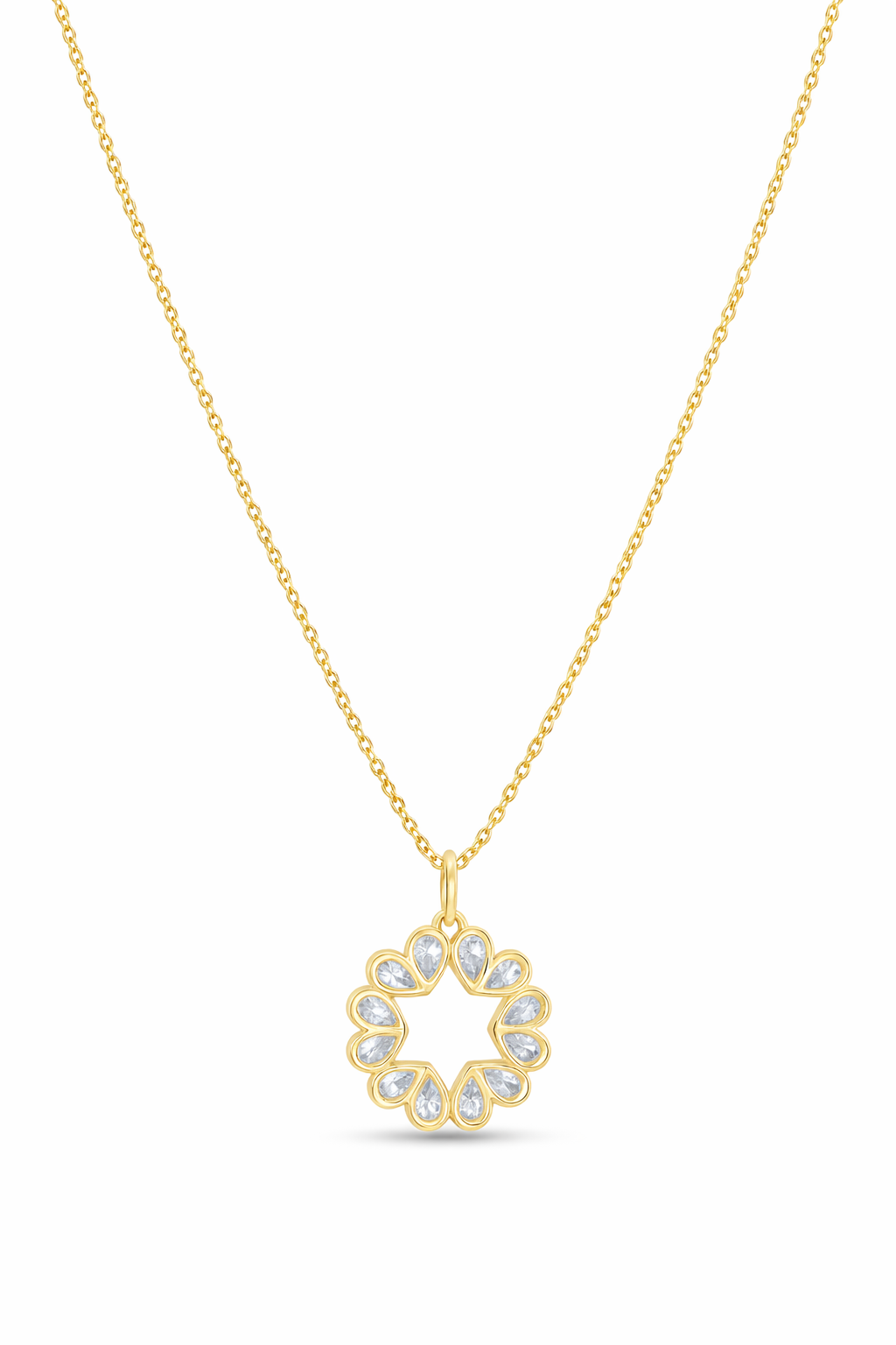 Gold necklace with a circular pendant on a white background