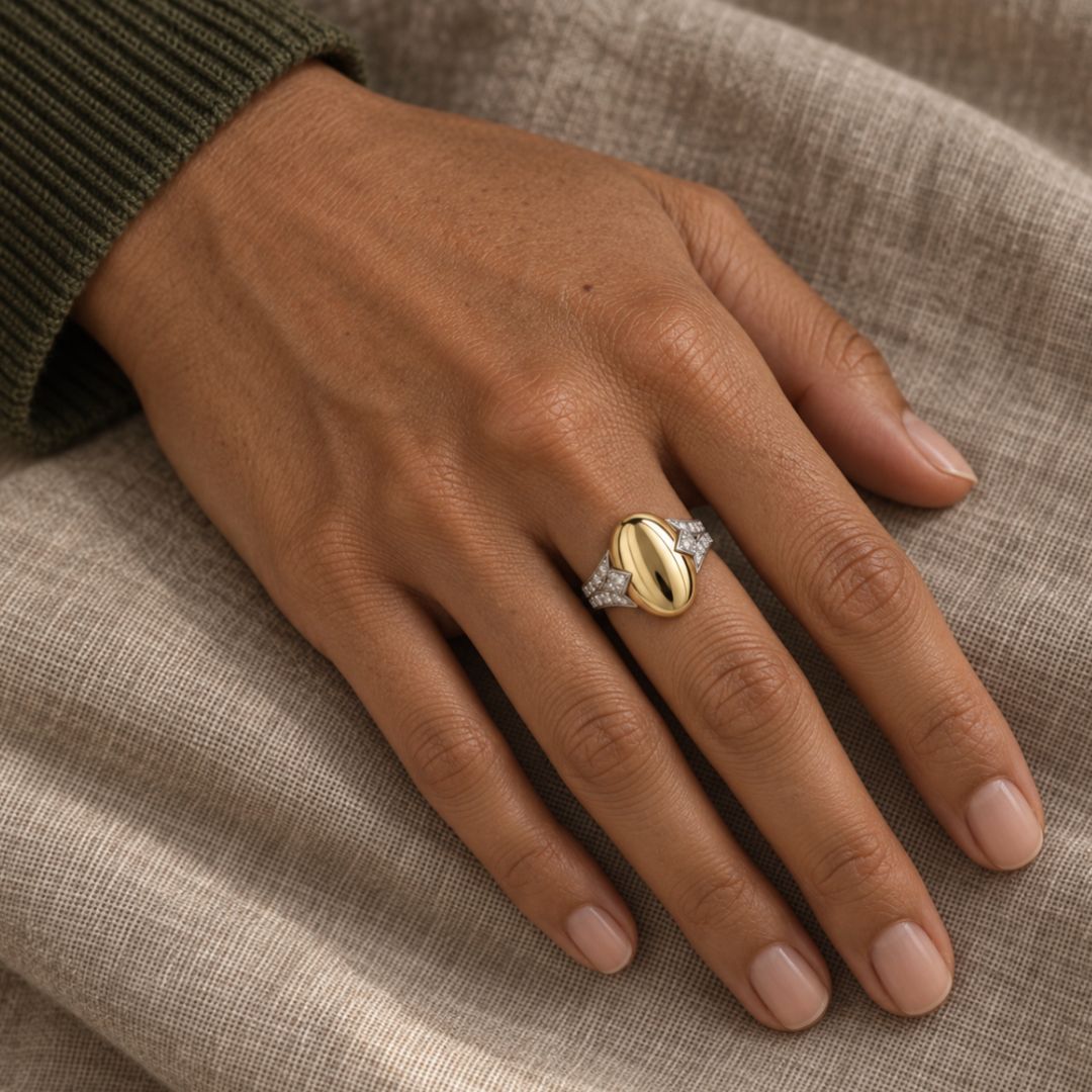 The Bean ring in mixed metals with gold vermeil and lab diamonds on a models hand