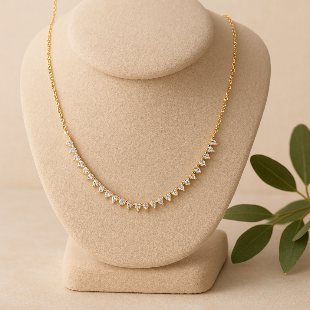 Gold necklace on a mannequin bust with a beige background