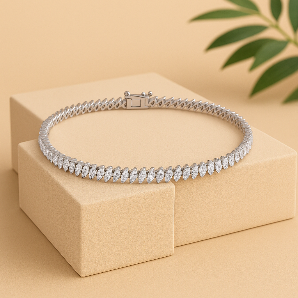 Silver bracelet with clear stones on a beige box with green leaves in the background