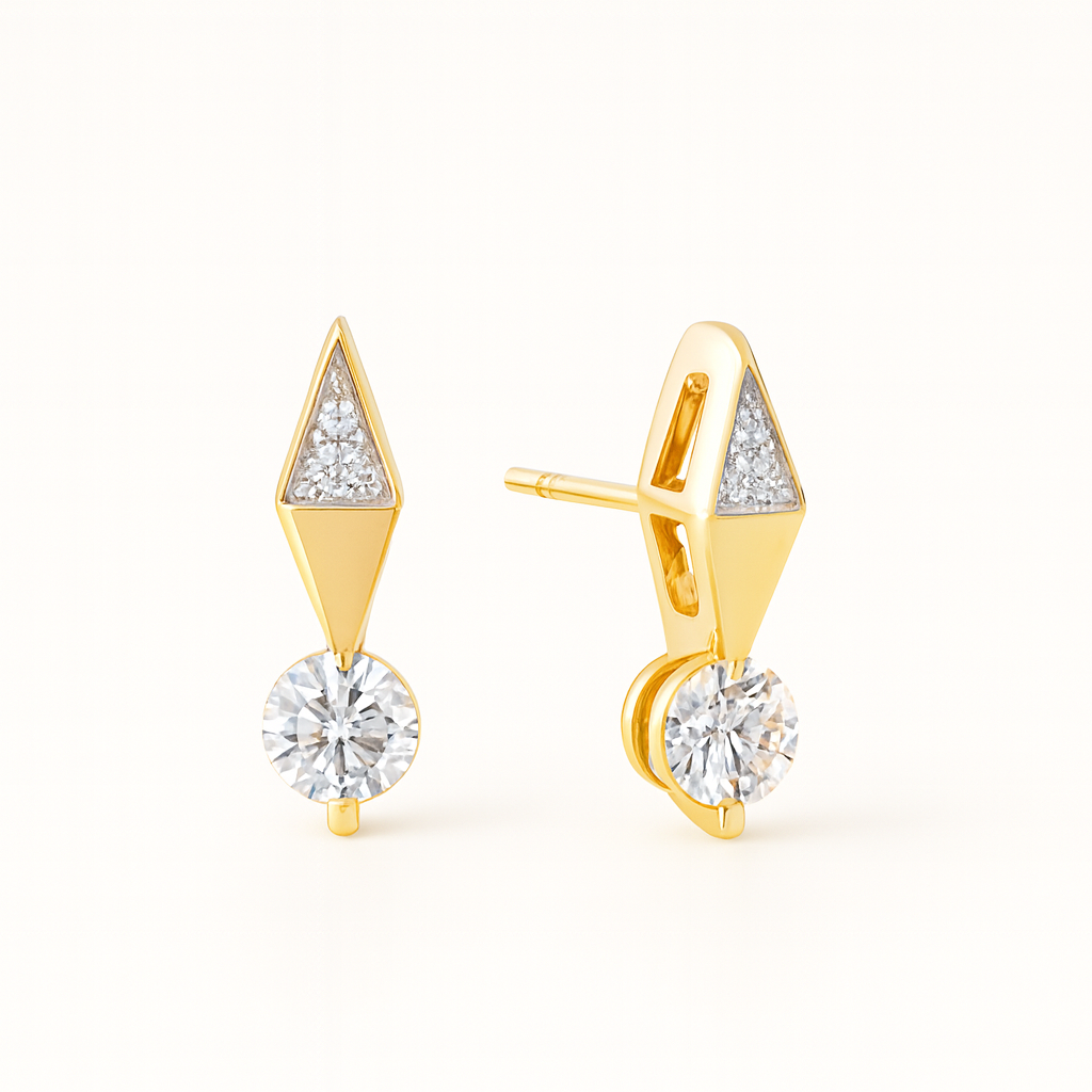 Gold earrings with diamond-like stones on a white background
